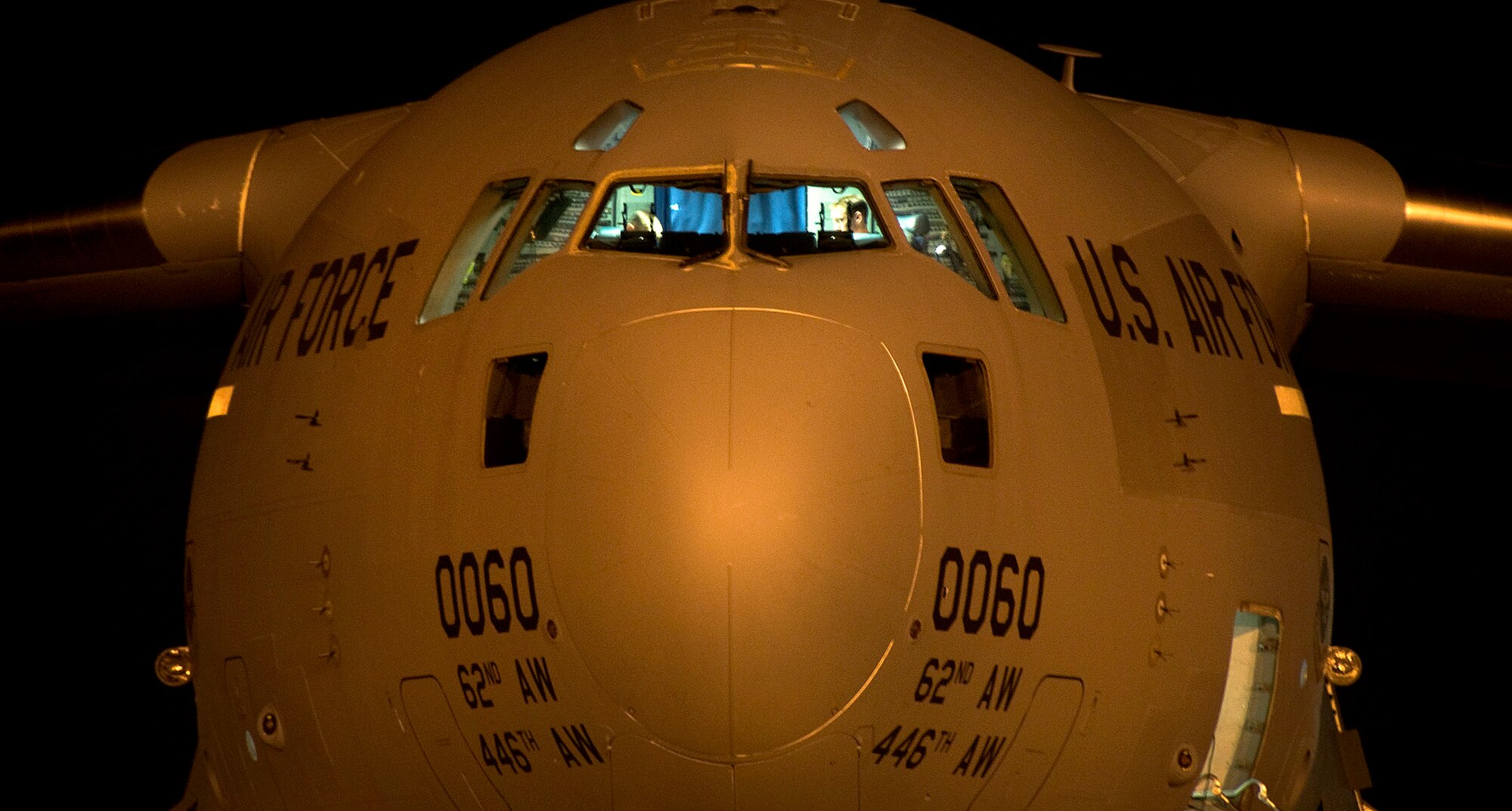 A McChord AFB C-17 awaits engine startup on the flightline at Charleston AFB Jan. 18. Since the recent earthquake which struck Haiti, active-duty and Reserve Airmen have worked around the clock in support of humanitarian aid missions to save lives and bring relief to earthquake victims. The McChord C-17 was flown out of Charleston AFB at approximately 6:30 a.m. on the first mission from Charleston since the base assumed the role of a distribution hub for food and water to Haiti. (U.S. Air Force photo/Staff Sgt. Daniel Bowles)