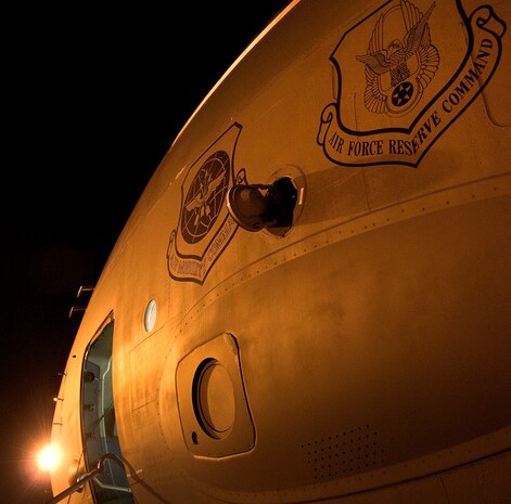 mission to Haiti on the flightline at Charleston AFB Jan. 18. Members of the 437th Aerial Port Squadron and 10th Airlift Squadron loadmasters worked together to load 16 pallets of humanitarian aid, which weighed approximately 116,000 pounds and included more than 40,000 bottles of water and 30,000 meals. The supplies were flown out of Charleston AFB at approximately 6:30 a.m. on the first mission to leave the base since it assumed the role of a distribution hub for food and water to Haiti. (U.S. Air Force photo/Staff Sgt. Daniel Bowles)