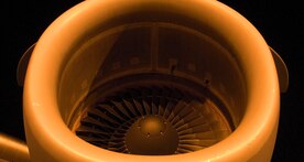 The jet engine of a McChord AFB C-17 awaits startup shortly before a mission to Haiti on the flightline at Charleston AFB Jan. 18. Members of the 437th Aerial Port Squadron and 10th Airlift Squadron loadmasters worked together to load 16 pallets of humanitarian aid, which weighed approximately 116,000 pounds and included more than 40,000 bottles of water and 30,000 meals. The supplies were flown out of Charleston AFB at approximately 6:30 a.m. on the first mission to leave the base since it assumed the role of a distribution hub for food and water to Haiti. (U.S. Air Force photo/Staff Sgt. Daniel Bowles)