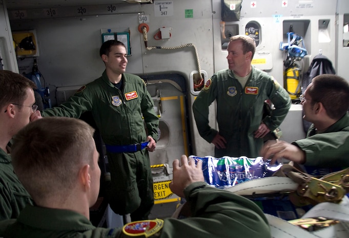 Aircrew members with the 10th Airlift Squadron gather together for a crew briefing shortly before launching out of Charleston AFB on a humanitarian aid mission to Haiti Jan. 18. The mission was a first for the crew and a first for Charleston AFB serving as a distribution hub for food and water shipments the to impoverished nation which was recently struck by a magnitude-7.0 earthquake. The 10 AS is based out of McChord AFB, Wash. (U.S. Air Force photo/Staff Sgt. Daniel Bowles)
