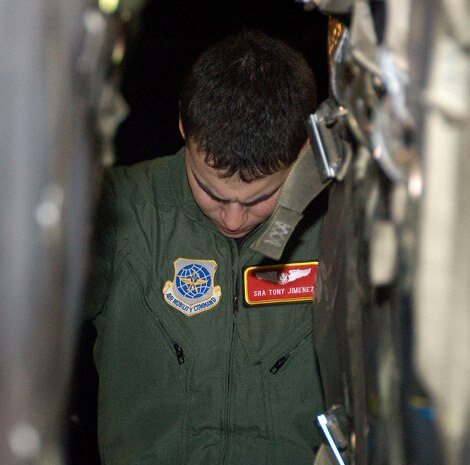 Senior Airman Anthony Jimenez eyes the alignment of pallets aboard a McChord C-17 on the Charleston AFB flightline Jan. 18. Sixteen pallets of food and water were loaded during the first of many missions to be flown out of Charleston AFB to aid victims of the recent earthquake in Haiti. Airman Jimenez is a loadmaster with the 10th Airlift Squadron, McChord AFB, Wash. (U.S. Air Force photo/Staff Sgt. Daniel Bowles)