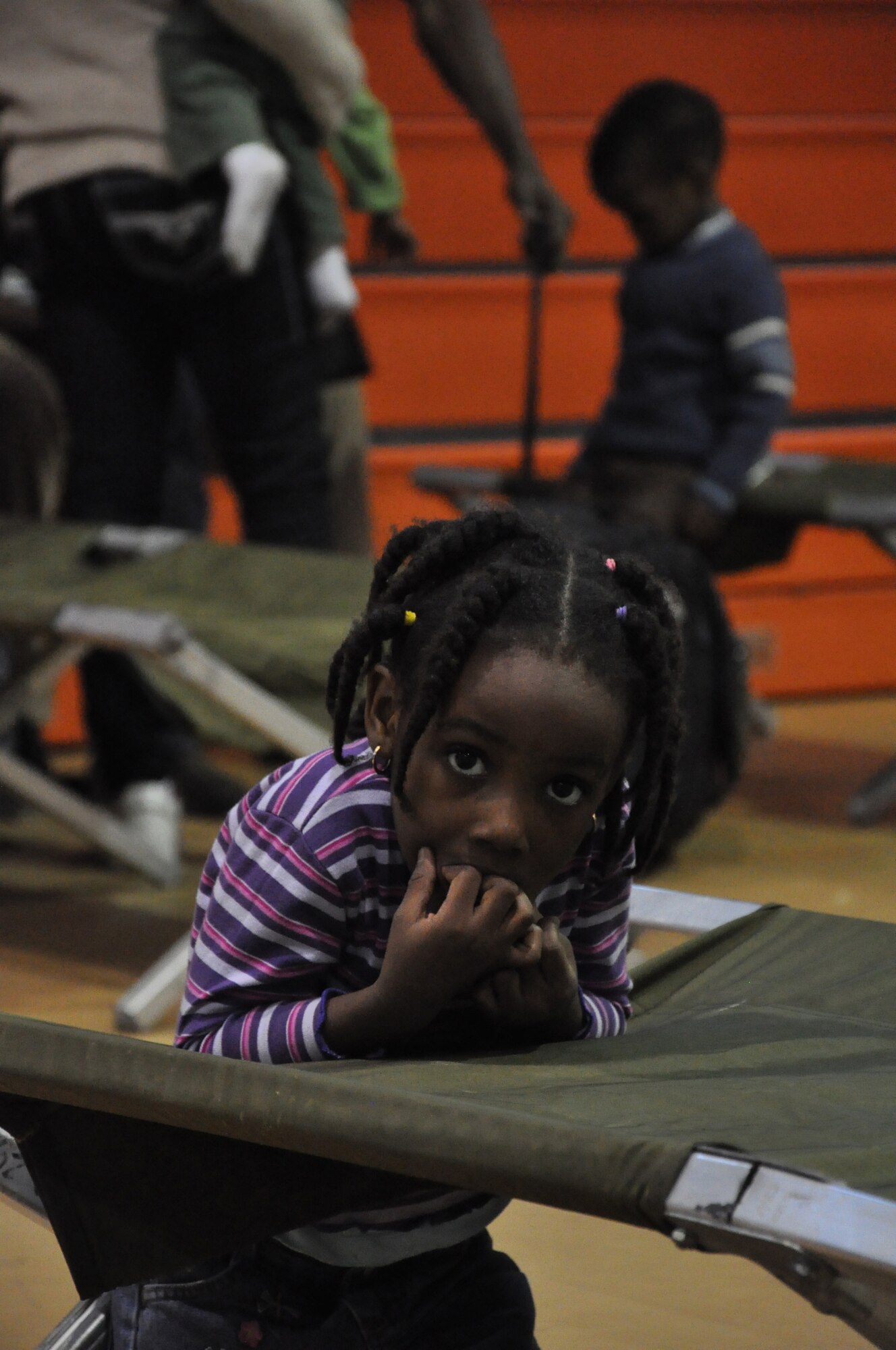 People of all ages have been affected by the devastation accompanied by the Earthquake in Haiti. Men, women, and children have been evacuated to the Homestead Air Reserve Base in order to process through customs, after providing proper citizenship documentation they are escorted home. (U.S. Air Force photo/ Tech. Sgt. Robert D. Gibson) 
