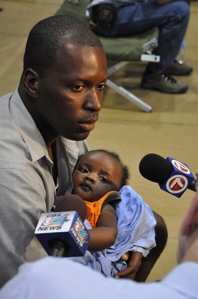 A firestorm of media descended upon Homestead Air Reserve Base after American citizens returned from Haiti aboard a C-130 Jan. 15, 2010. During a Customs and Border check, media documented the varied stories of survival. (U.S. Air Force photo/Tech. Sgt. Robert D. Gibson)
