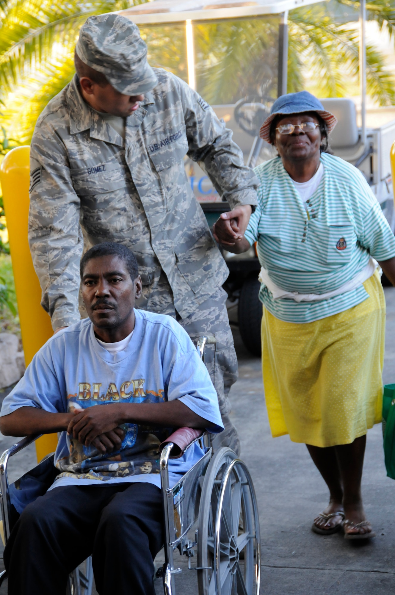 Staff Sgt Johann Gomez of the 48nd Fighter Wing Civil Engineering Squadron helps assist American survivors of the Haiti earthquake into the Homestead Air Reserve Base gymnasium Fri. Jan. 15, 2010. (U.S. Air Force photo/ Senior Airman Lou Burton)