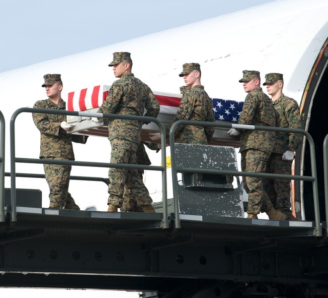 16 January 2010 USAF Photo by Brianne Zimny.  A United States Marine Corps carry team transfers the remains of Sgt Christopher Hrbek, 25, of Westwood, NJ., at Dover Air Force Base, Del., on January 16, 2010. Sgt. Hrbek was assigned to the 3d Battalion, 10th Marine Regiment, 2nd Marine Division, II ,arine Expeditionary Force in Camp Lejeune, N.C.  He died Jan. 14 while supporting combat operations in Helmand province, Afghanistan.  