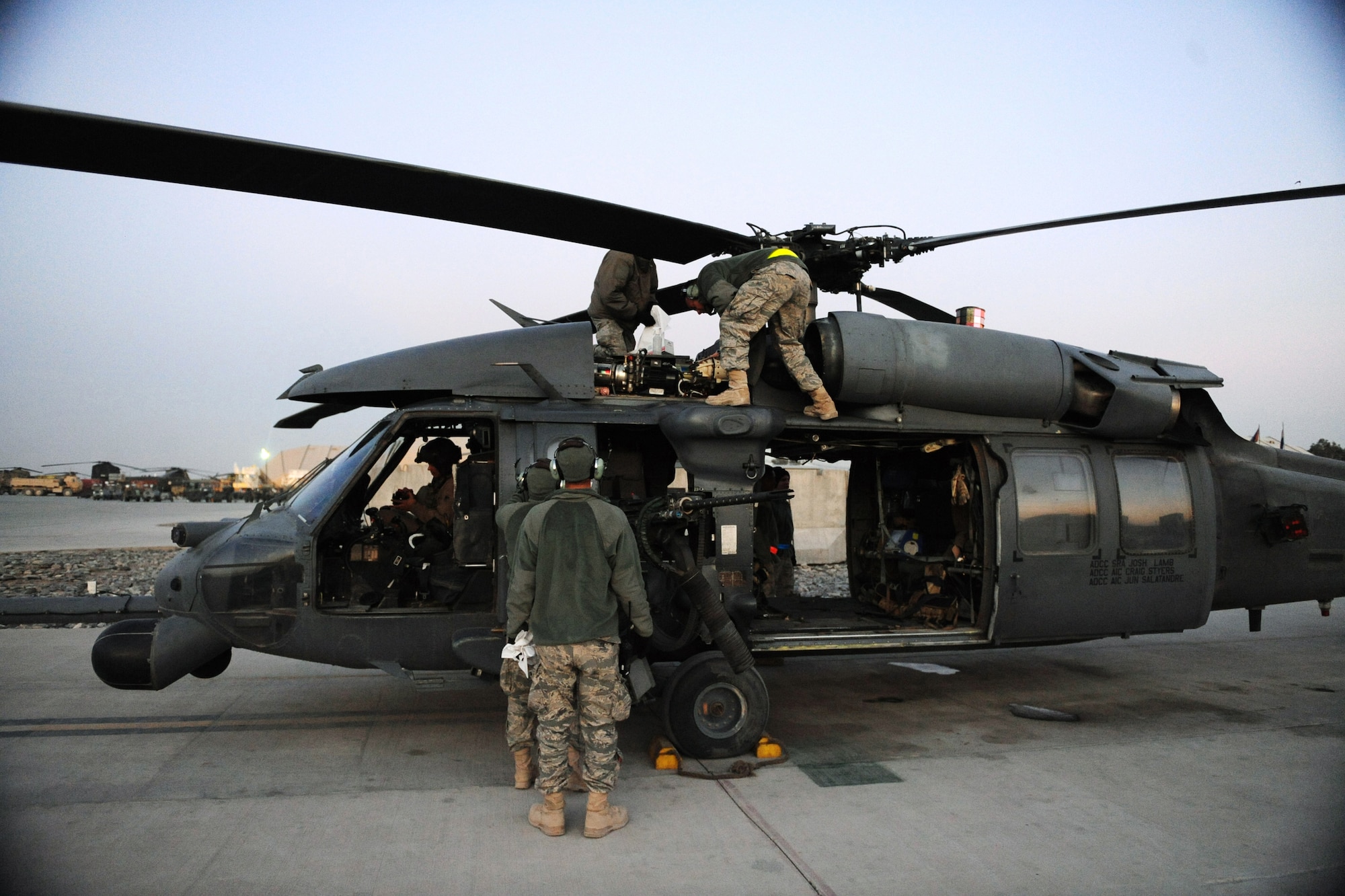 U.S. Air Force aircraft maintenance Airmen from the 66th Expeditionary Rescue squadron  perform minor maintenance on an alert HH-60G Pave Hawk after a medical evacuation mission Jan. 10, 2010, at Kandahar Airfield, Afghanistan. (U.S. Air Force photo/Staff Sgt. Manuel J. Martinez/Released)
