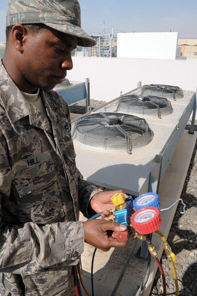 U.S. Air Force Tech. Sgt. Roderick Hill, heating, ventilation and air conditioning craftsman with the 380th Expeditionary Civil Engineer Squadron, checks an air conditioning unit during operations at a non-disclosed base in Southwest Asia on Jan. 17, 2010. A 12-year veteran of the Air Force, Sergeant Hill is responsible for maintaining HVAC equipment throughout the 380th Air Expeditionary Wing. Sergeant Hill is deployed from the 786th Civil Engineer Squadron at Ramstein Air Base, Germany, and his hometown is Moreauville, La. (U.S. Air Force photo by Tech. Sgt. Scott T. Sturkol)