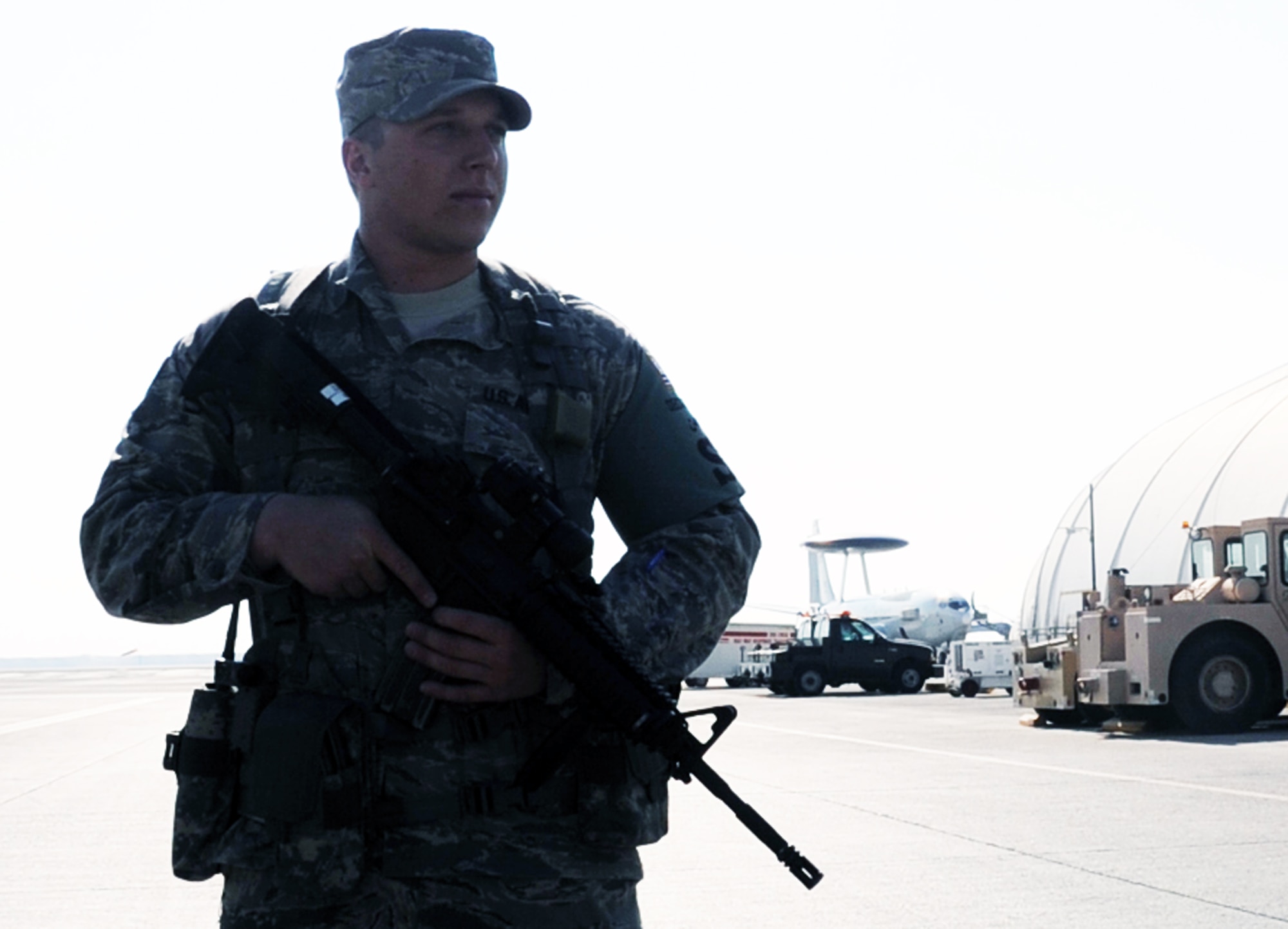 Senior Airman Jeffery Fitzgerald, security forces journeyman with the 380th Expeditionary Security Forces Squadron, watches over the flightline at a non-disclosed location in Southwest Asia.  Air Force security forces Airmen like Airman Fitzgerald ensure the security of the 380th Air Expeditionary Wing areas of operation and protect millions of dollars worth of assets.  Airman Fitzgerald is deployed from the 81st Security Forces Squadron at Keesler Air Force Base, Miss., and his hometown is Smiths Station, Ala.  (U.S. Air Force Photo/Tech. Sgt. Scott T. Sturkol/Released)