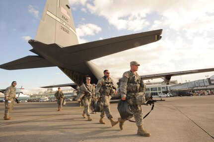 Soldiers from the 82nd Airborne Division based at Ft. Bragg, N.C., depart a Little Rock Air Force Base, Ark., C-130J Hercules aircraft at Port-au-Prince International Airport, Haiti, Jan. 16, 2010. These soldiers will be providing security, medical support, and command for the troops and assisting in in Haitian relief efforts after a devastating earthquake struck the country Jan. 12, 2010. Little Rock AFB is a component of Air Mobility Command. Since relief operations began Jan. 13, 2010, AMC aircraft have deliver more than 323 tons of emergency tons of cargo to Haiti. (USAF Photo by Staff Sgt. Chad Chisholm) (RELEASED)
