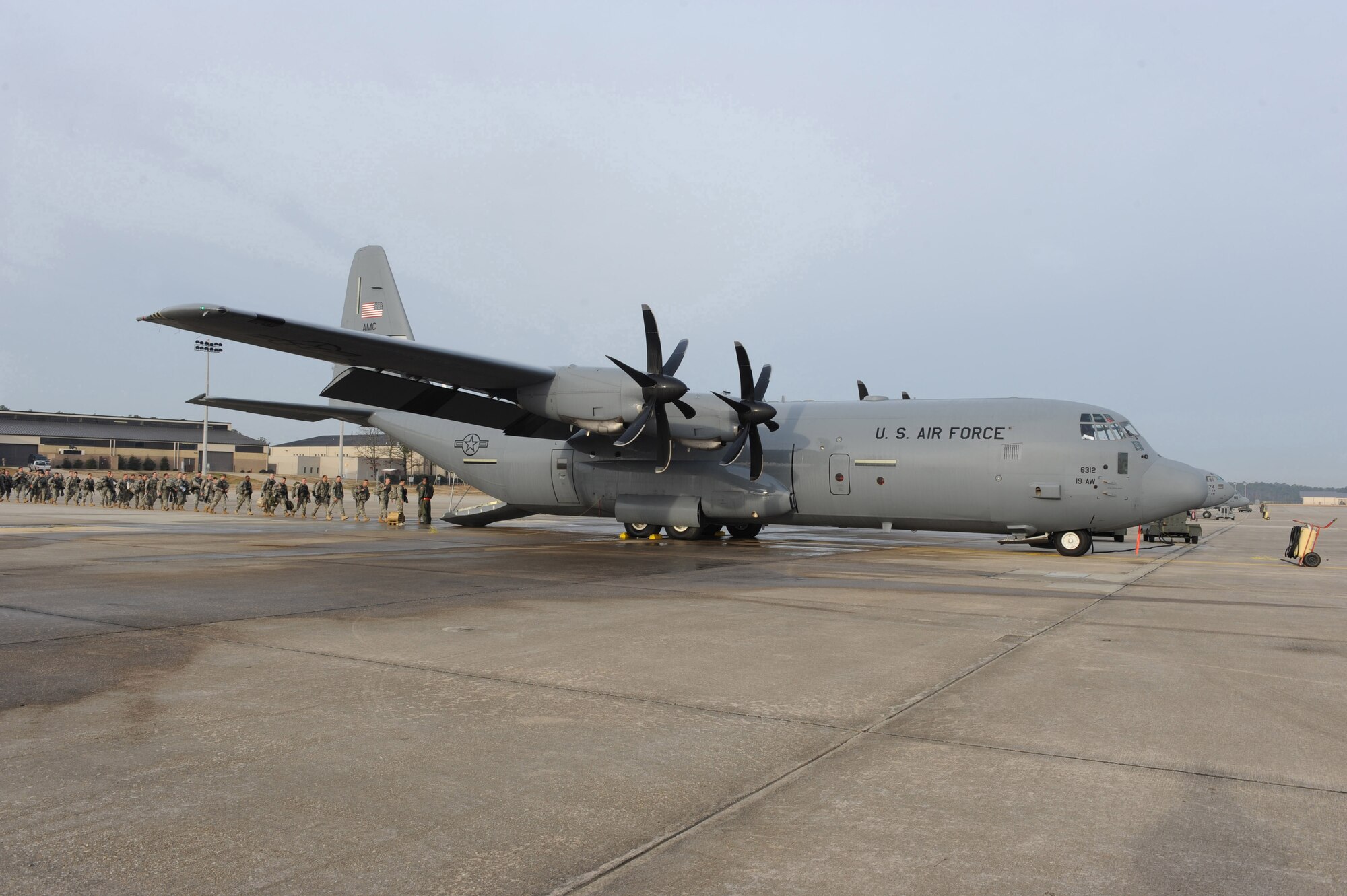 Soldiers from the 82nd Airborne Division, Ft. Bragg, N.C., board a Little Rock Air Force Base, Ark., C-130J Hercules at Pope Air Force Base, S.C., Jan. 16, 2010.  The C-130J aircraft will be transporting the Soldiers and various supplies to assist in Haitian relief efforts after a devastating earthquake struck the country Jan. 12, 2010. Little Rock AFB is a component of Air Mobility Command. Since relief operations began Jan. 13, 2010, AMC aircraft have deliver more than 323 tons of emergency tons of cargo to Haiti. (USAF Photo by Staff Sgt. Chad Chisholm) (RELEASED)
