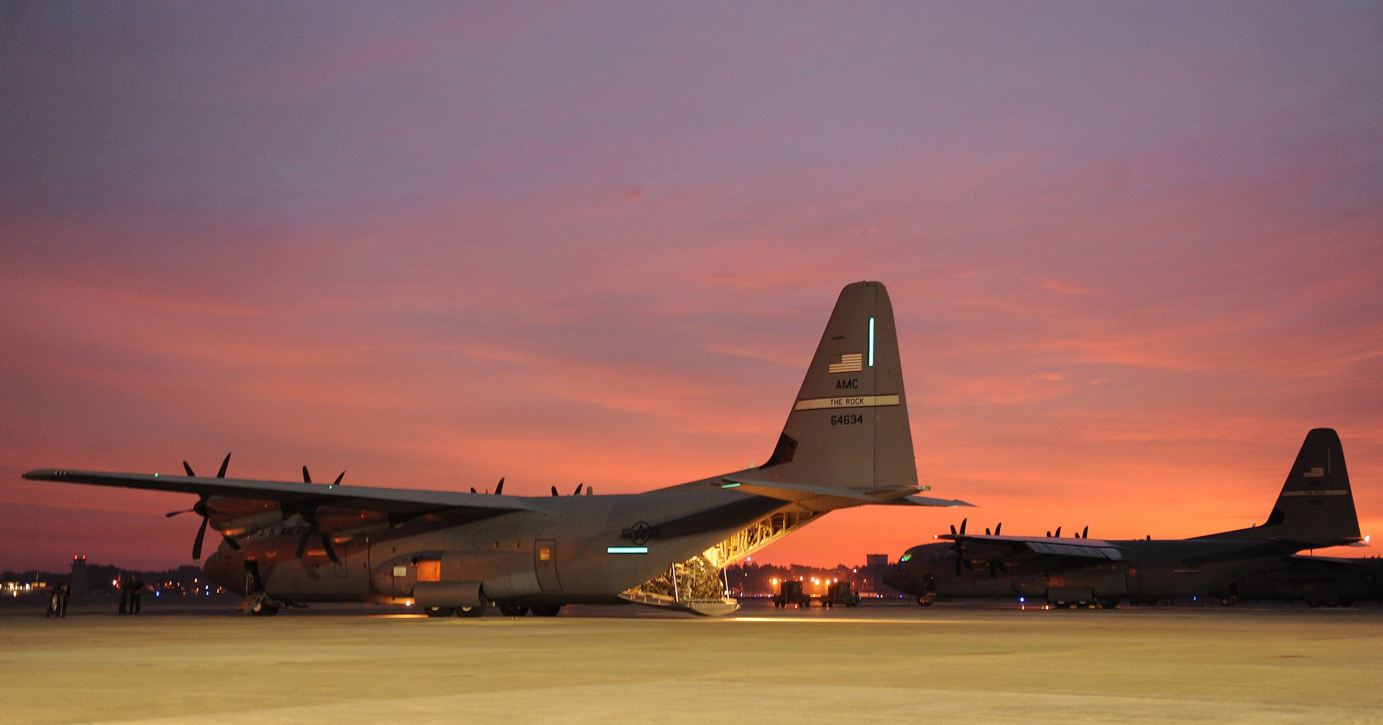 Two Little Rock Air Force Base, Ark., C-130J Hercules aircraft prepare to depart Pope Air Force Base, N.C., to travel to Port-au-Prince International Airport, Haiti Jan. 17, 2010. The C-130J will be transporting personnel, medical supplies and equipment to aid in the Haitian relief efforts after a devastating earthquake struck the country Jan. 12, 2010. Little Rock AFB is a component of Air Mobility Command. Since relief operations began Jan. 13, 2010, AMC aircraft have deliver more than 323 tons of emergency tons of cargo to Haiti. (USAF Photo by Staff Sgt. Chad Chisholm) (RELEASED)