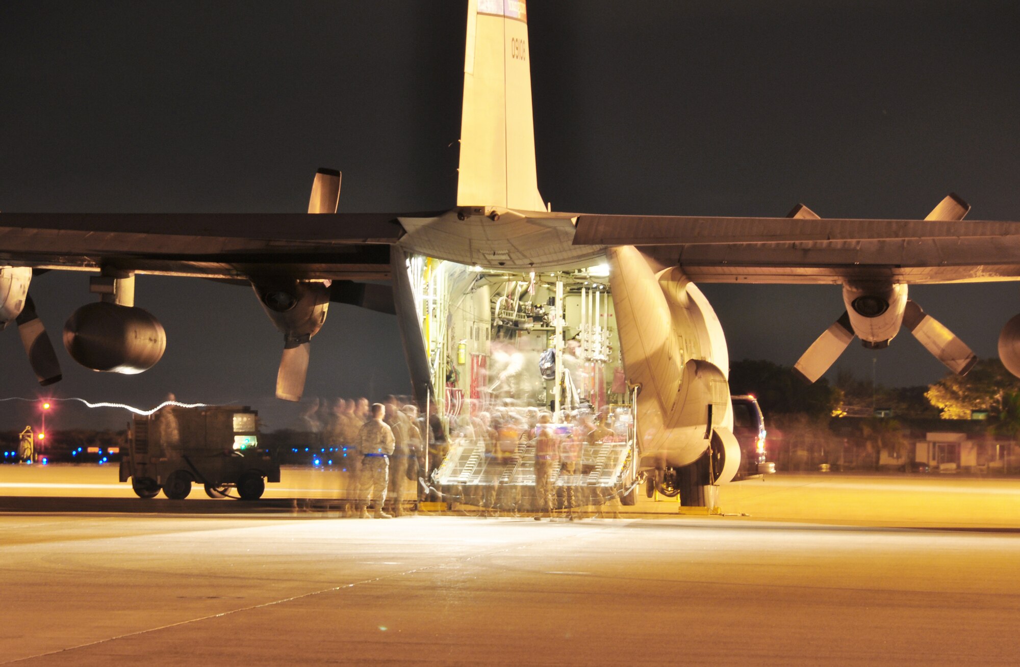 Members of Joint Task Force-Bravo?s 612th Air Base Squadron prepare one of three C-130 Hercules to carry 23 JTF-B medical element personnel, along with 51,000 pounds of supplies from Soto Cano Air Base, Honduras, to Haiti Jan. 17, 2010. The medical team deployed to join Joint Task Force-Haiti in support of Operation Unified Response, the joint U.S. military disaster relief mission there. (U.S. Air Force photo/Staff Sgt. Bryan Franks)
