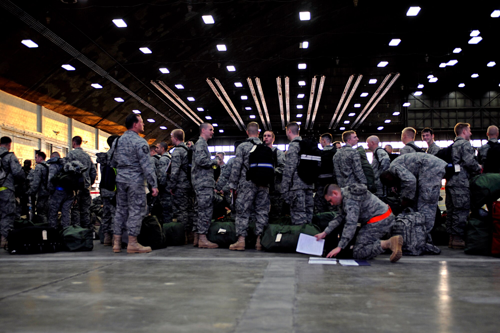 ELLSWORTH AIR FORCE BASE, S.D. -- Airmen wait to begin deployment processing to Southwest Asia, Jan. 17. The more than 300 Airmen, in various roles, deployed in support of operations at the 379th Air Expeditionary Wing. (U.S. Air Force photo/Airman 1st Class Matthew Flynn)