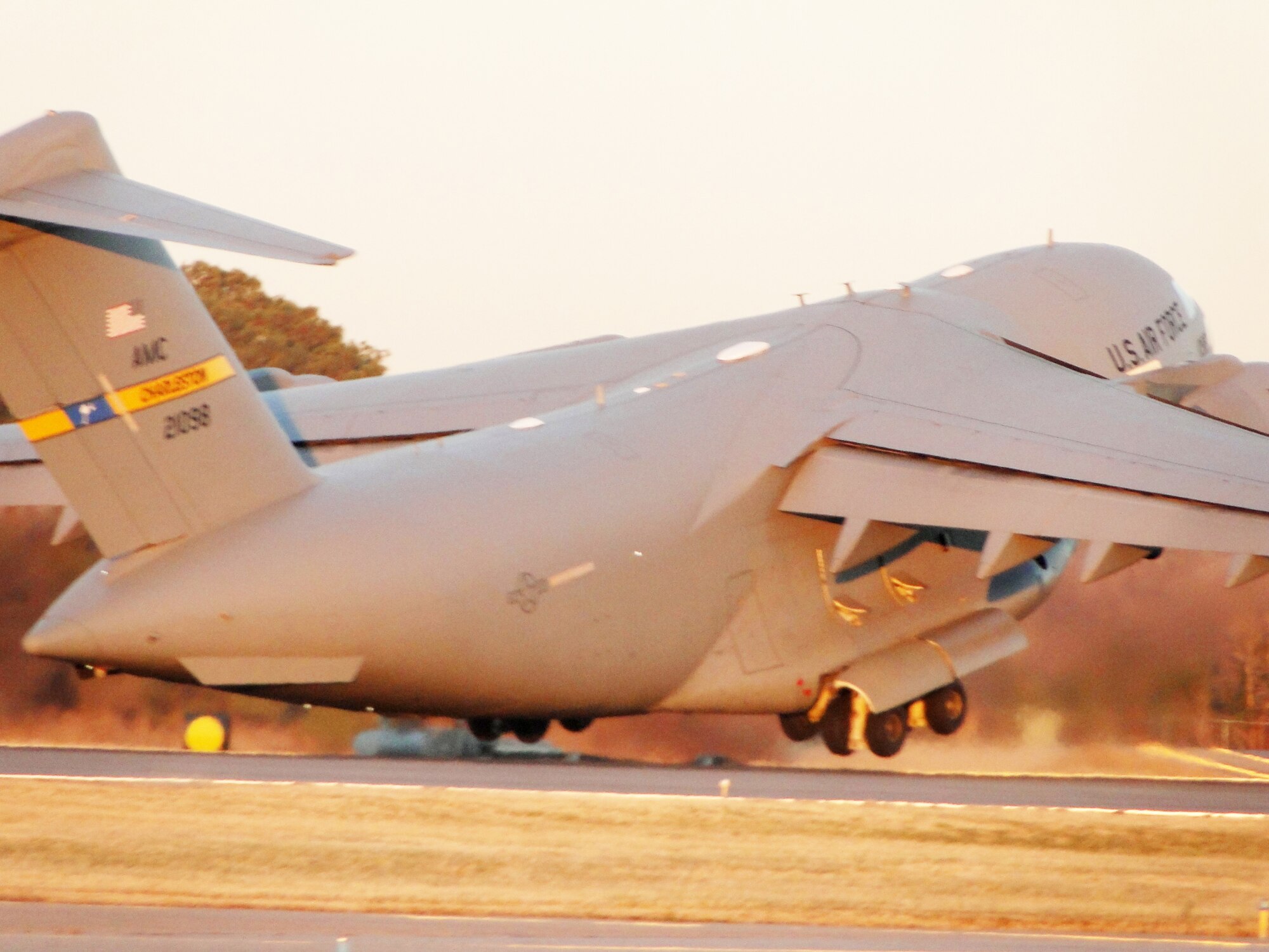 A C-17 Globemaster III takes off from Chambers Field, Naval Station Norfolk, Va., Jan. 15, 2010. The C-17 carried cargo and members of Virginia Task Force 2, a Federal Emergency Management Agency urban search and rescue team based in Virginia Beach, Va., to support ongoing relief operations in earthquake-stricken Haiti. The C17 is assigned to the 437th Airlift Wing at Charleston Air Force Base, S.C. (U.S. Air Force photo/Capt. Ed Ekpoudom)                               