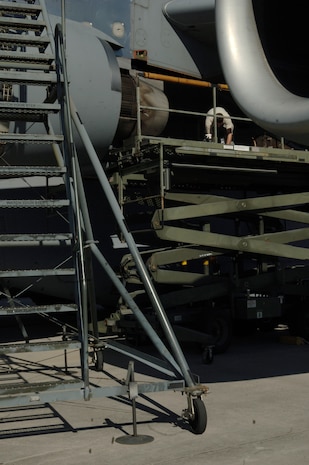 Airman 1st Class Graham Robinson repairs damage to a C-17 engine that occurred during a flight back to Charleston AFB from Haiti during a humanitarian relief mission Jan. 19. The C-17 belongs to McChord Air Force Base and is one of many C-17s tasked for relief missions. (U.S. Air Force photo/Airman 1st Class Lauren Main)