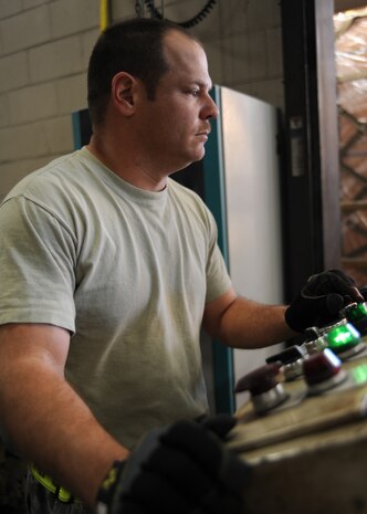 Master Sgt. Brad Kirk moves a pallet of water out to be loaded on Charleston AFB, Jan. 19. Air Mobility Command is responding with all necessary forces and equipment to aide the humanitarian relief efforts in Haiti. Sergeant Kirk is the cargo processing non-commissioned officer in charge and is with the 437th Aerial Port Squadron. (U.S. Air Force photo/Senior Airman Katie Gieratz)(RELEASED)