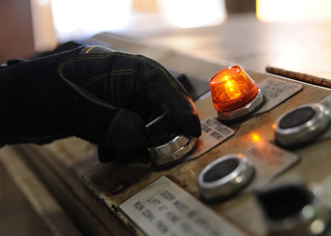 Master Sgt. Brad Kirk moves a pallet of water out to be loaded onto a C-17 at  Charleston AFB, Jan. 19. Air Mobility Command is participating in a swift and coordinated relief effort to save lives in the aftermath of the earthquake that struck Port-au-Prince, Haiti. Sergeant Kirk is the cargo processing non-commissioned officer in charge and is with the 437th Aerial Port Squadron. (U.S. Air Force photo/Senior Airman Katie Gieratz)(RELEASED)