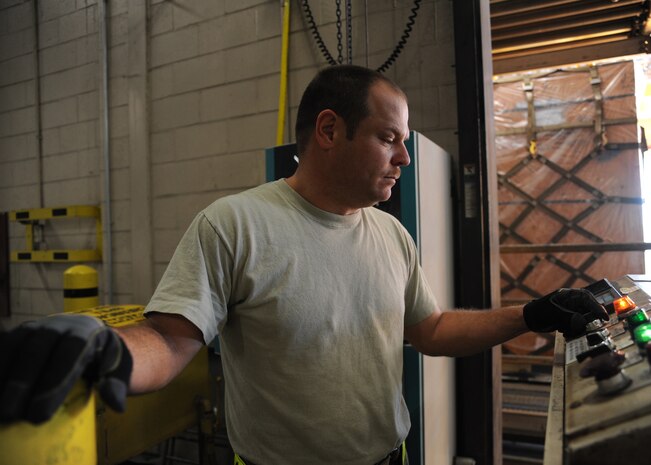 Master Sgt. Brad Kirk moves a pallet of water out to be eventually loaded onto a C-17  Charleston AFB, Jan. 19. The water is being sent to Haiti to assist in the humanitarian relief effort. Sergeant Kirk is the cargo processing non-commissioned officer in charge and is with the 437th Aerial Port Squadron. (U.S. Air Force photo/Senior Airman Katie Gieratz)(RELEASED)
