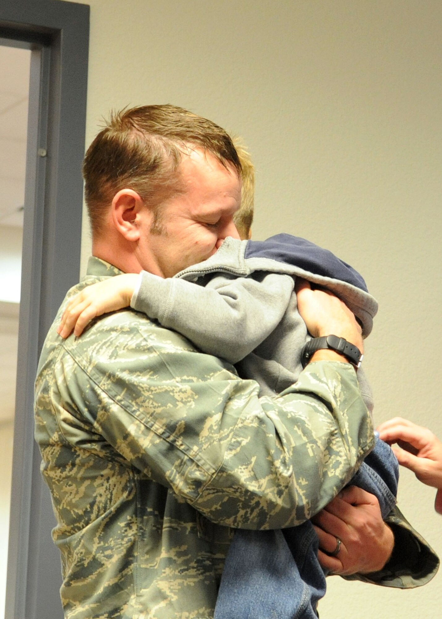Capt. Marcus Truman, 48th Rescue Squadron, embraces his son Colton Truman, 5 here Jan. 16. Capt. Truman along with 14 members of the 48th Rescue Squadron were welcomed home by their families early Saturday morning after a 5 month  deployment to Bagram Air Base, Afghanistan where they took part in personnel recovery and medevac missions. (U.S. Air Force photo/Airman Jerilyn Quintanilla)