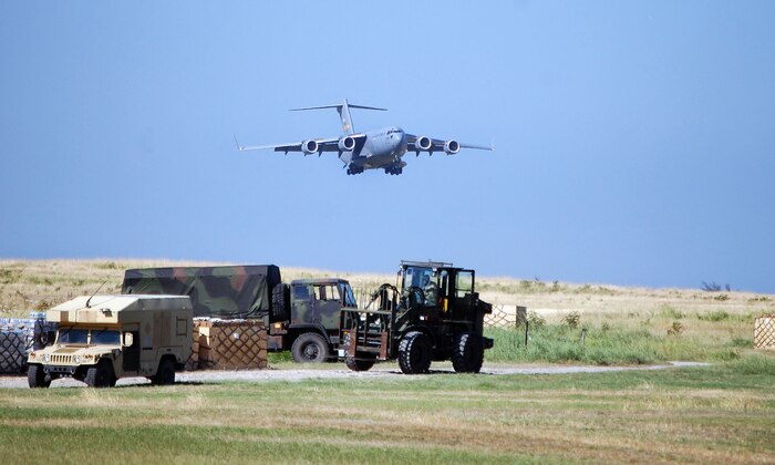 A C-17 Globemaster III from Charleston AFB arrives at Port-au-Prince, Haiti, with relief supplies for U.S. service members and Haitian residents affected by the Jan. 12 7.0-magnitude earthquake Jan. 18, 2010.  Charleston AFB is the Air Force?s air operations hub for all C-17 relief effort flights. (U.S. Air Force photo/Master Sgt. Sean P. Houlihan)
