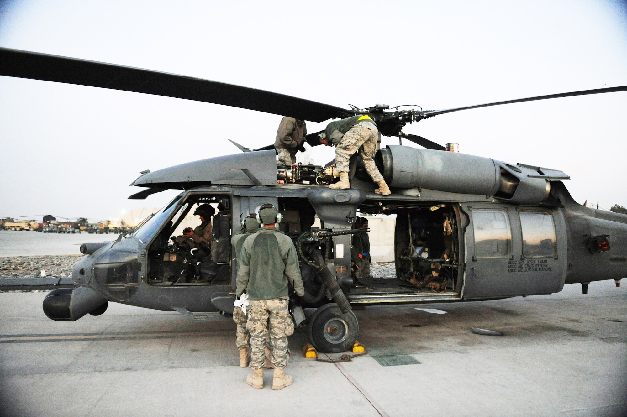 Airmen perform minor maintenance on an alert HH-60G Pave Hawk after a medical evacuation mission Jan. 10, 2010, at Kandahar Airfield, Afghanistan. The Airmen are assigned to the 66th Expeditionary Rescue squadron. (Air Force photo/Staff Sgt. Manuel J. Martinez)