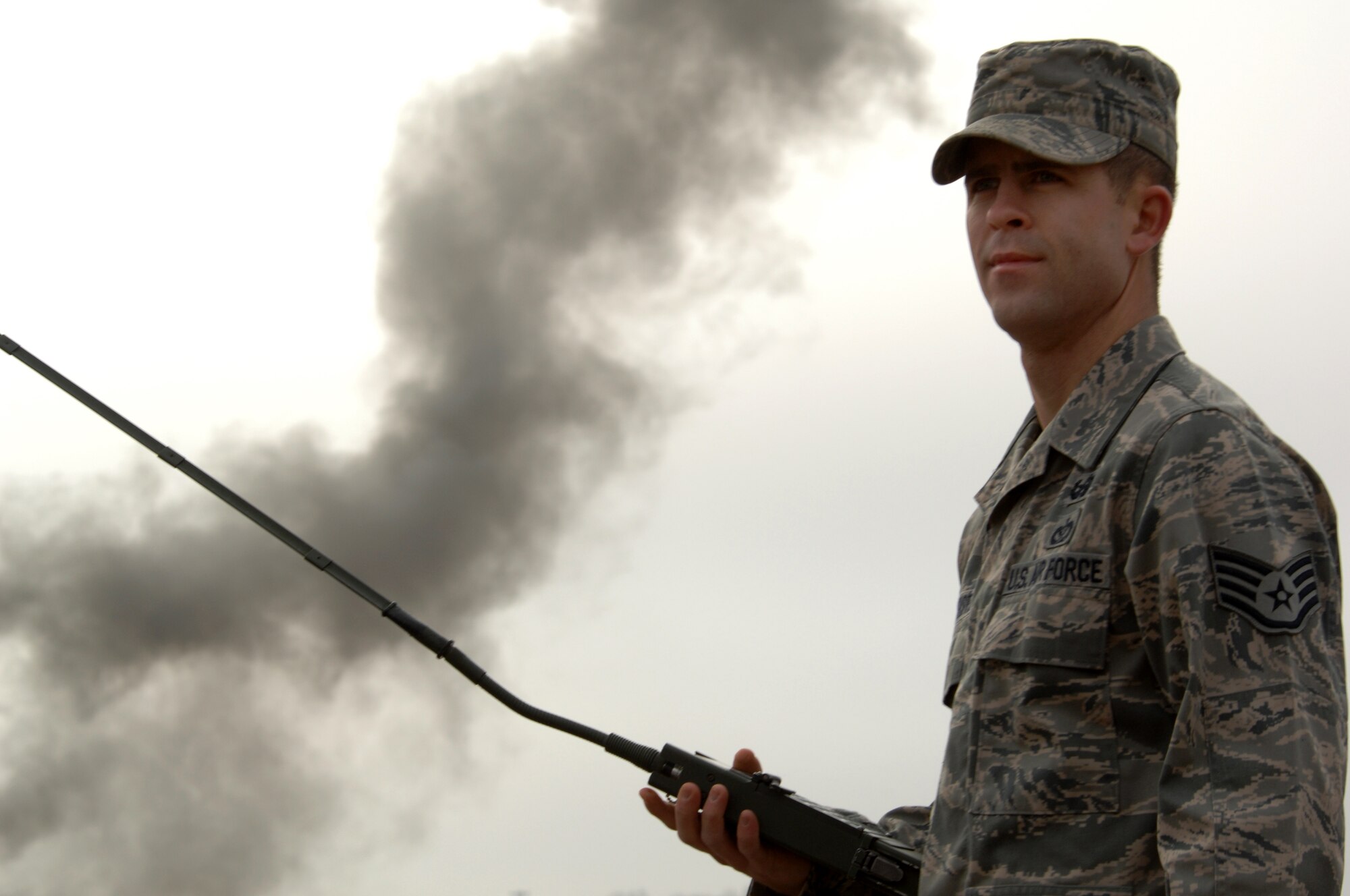 WHITEMAN AIR FORCE BASE, Mo. – Staff Sgt. Brandon Pfannenstiel, 509th Civil Engineer Squadron explosive ordnance device technician, uses a remote firing device to set off C-4 during a training session Jan. 19, 2010.  EOD members train often in the field and the class room to maintain proficiency. (U.S. Air Force photo/Senior Airman Jessica Mae Snow) (Released)