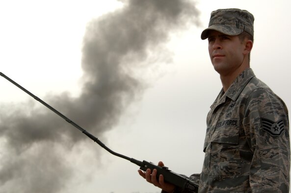 WHITEMAN AIR FORCE BASE, Mo. – Staff Sgt. Brandon Pfannenstiel, 509th Civil Engineer Squadron explosive ordnance device technician, uses a remote firing device to set off C-4 during a training session Jan. 19, 2010. EOD members train often in the field and the classroom to maintain proficiency. (U.S. Air Force photo/Senior Airman Jessica Mae Snow)