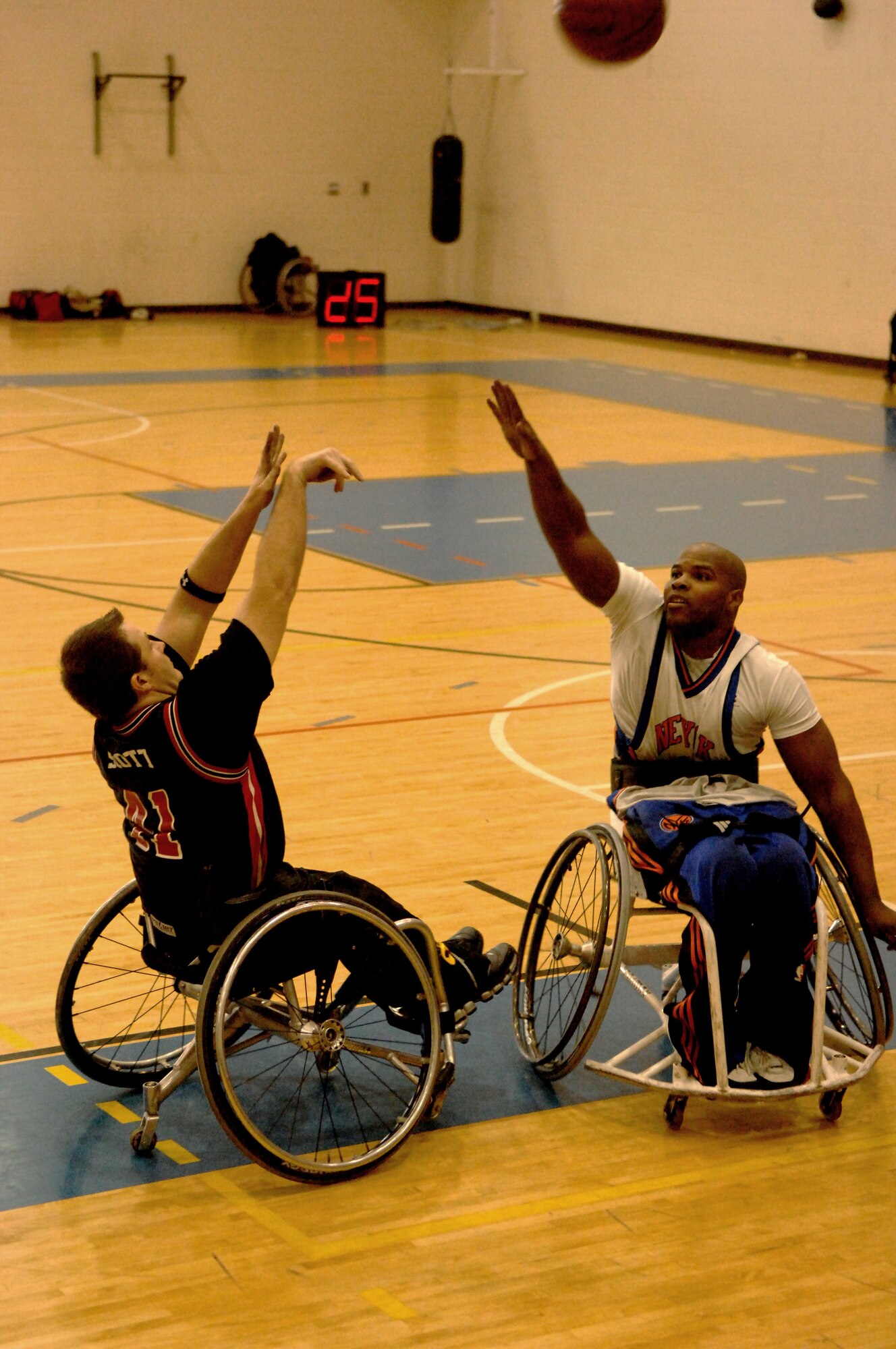 LANGLEY AIR FORCE BASE, Va. -- Charlottesville Cardinals guard Russell Scott shoots over New York Rollin' Knicks forward Kevin Grant in a tournament game Jan. 17. The Rollin' Knicks won the game in overtime 68-65. (U.S. Air Force photo/Airman 1st Class Jason J. Brown)