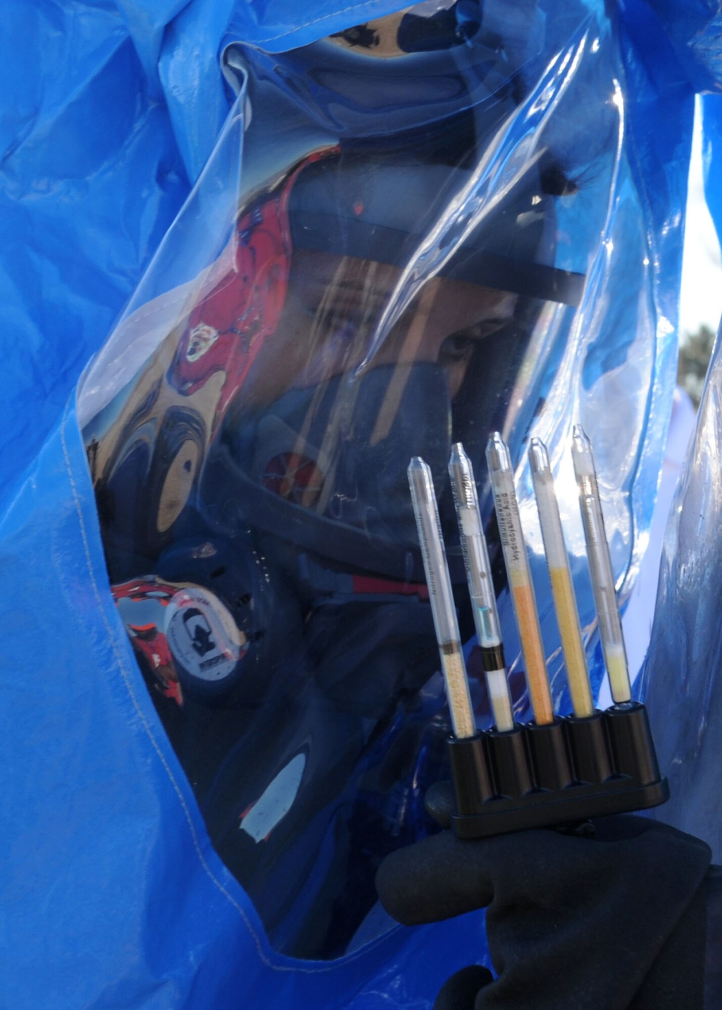 Senior Airman Judith Hoyt, 355th Aerospace Medicine Squadron, reads a drager
tube chart during an all hazards response training exercise here Jan. 13. Various squadrons took part in this exercise, to include the 355th Aerospace Medicine Squadron, the 355th Security Forces Squadron and the 355th Civil Engineer Squadron. The exercise was conducted to prepare base personnel in the event of a real emergency. (U.S. Air Force photo/Airman Jerilyn Quintanilla)
