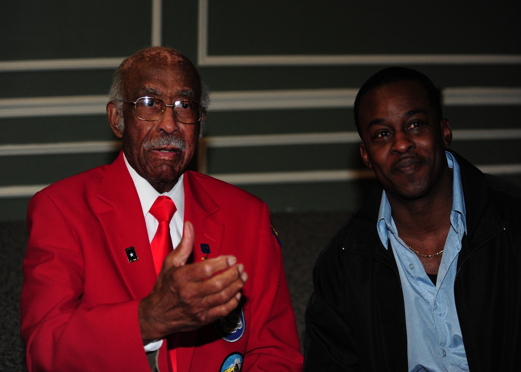 SHAW AIR FORCE BASE, S.C. -- Dr. Leroy Bowman (left), an original Tuskegee Airman, and Mr. Martin Chalmas (right), a contracting specialist with the 20th Contracting Squadron, enjoy a laugh after the Martin Luther King, Jr. Luncheon January 15, 2010. (U.S. Air Force Photo/2nd Lt Tony Richardson)