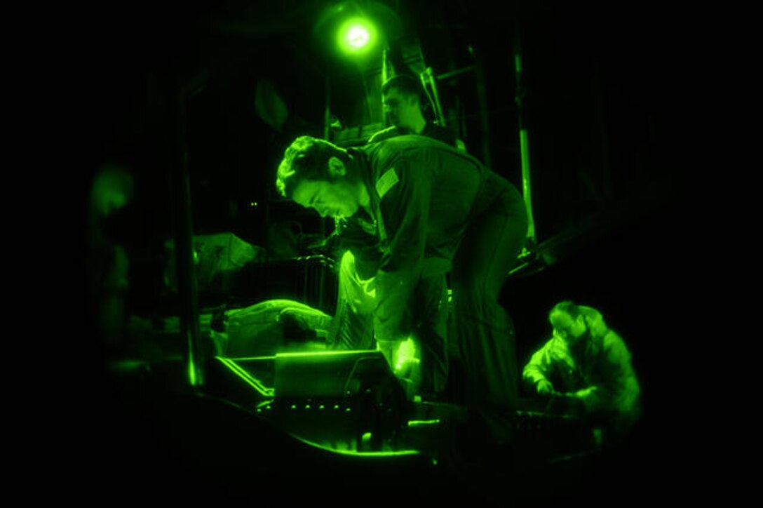 U.S. Air Force Master Sgt. Anastasios Vassilopanagos, a C-130 Hercules aircraft loadmaster and combat aviation advisor assigned to the 6th Special Operations Squadron, Hurlburt Field, Fla., straps cargo to a C-130E Hercules aircraft before departing for Haiti Jan. 13, 2010. Airmen assigned to the 1st Special Operations Wing will be part of a U.S. humanitarian relief mission to the earthquake-stricken country. (U.S. Air Force photo by Senior Airman Jason Epley/Released)