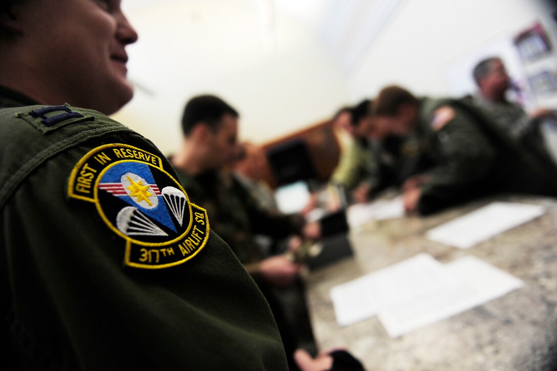 Airmen prepare to participate in a relief effort to Haiti, Jan. 14, 2010 at Charleston Air Force Base, S.C. The Airmen are reservists from the 317th Airlift Squadron, 437th Air Mobility Wing. (U.S. Air Force photo by Staff Sgt. Joshua L. DeMotts) 

