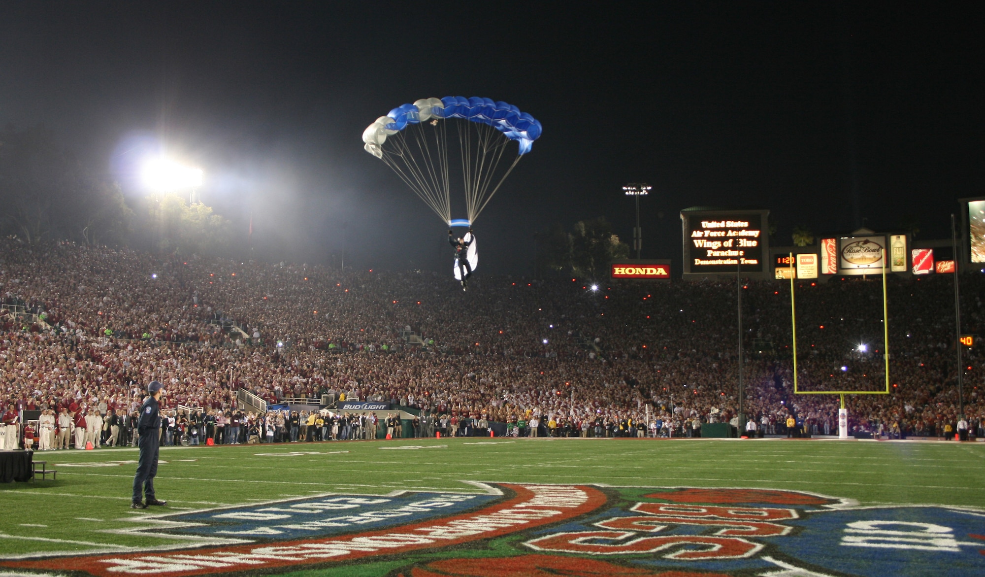 Cadet 1st Class David Leibrand soars into the Rose Bowl in Pasadena, Calif., before the BCS National Championship game between the Alabama Crimson Tide and the Texas Longhorns Jan. 8. Cadet Leibrand, a member of the Wings of Blue Air Force Parachute Demonstration Team, is a native of Scobey, Mont. (U.S. Air Force photo/Tech. Sgt. Kenny Kendrick)