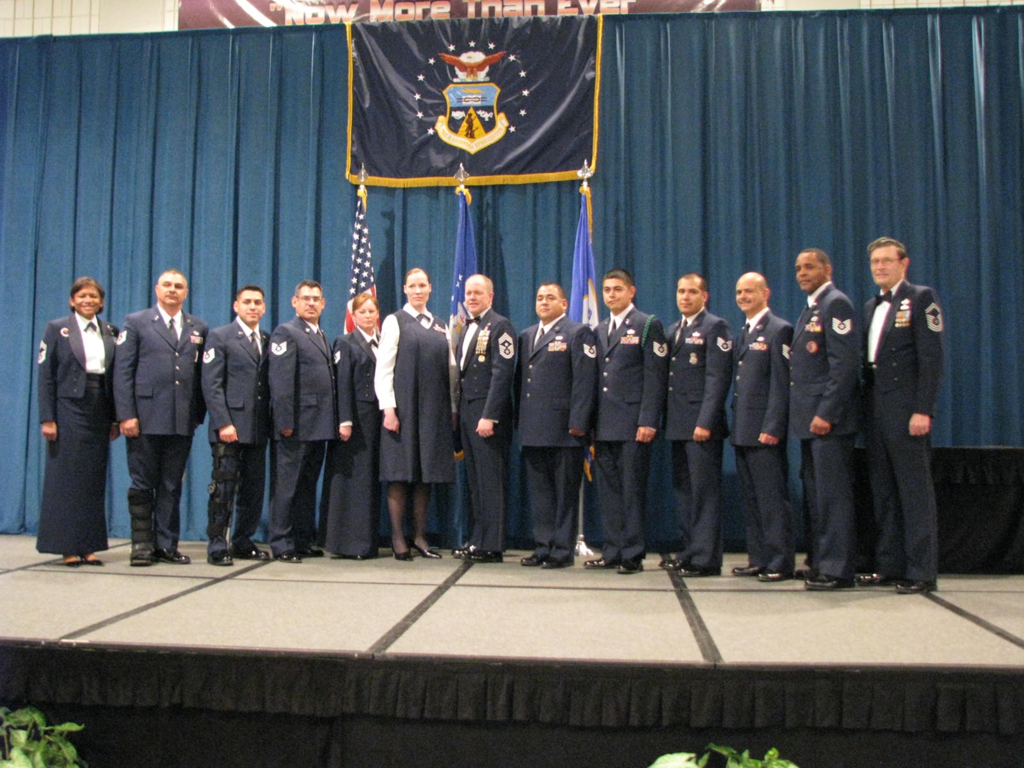 Graduates pose for a portrait after recieving their diplomas from Chief Master Sgt (Ret) Lynn Alexander at a Non-Commissioned Officer graduation ceremony at McGhee Tyson Air National Guard Base, TN on Dec. 15.  The students are from the Texas Air National Guard's 149th Fighter Wing and 273rd Information Operations Squardon participating in an Air National Guard satellite NCO professional education course where students take a portion of their courses locally and then conclude with a 17-day in-residence course at McGhee Tyson.  (U.S. Air Force photo by Chief Master Sgt Richard Pena)