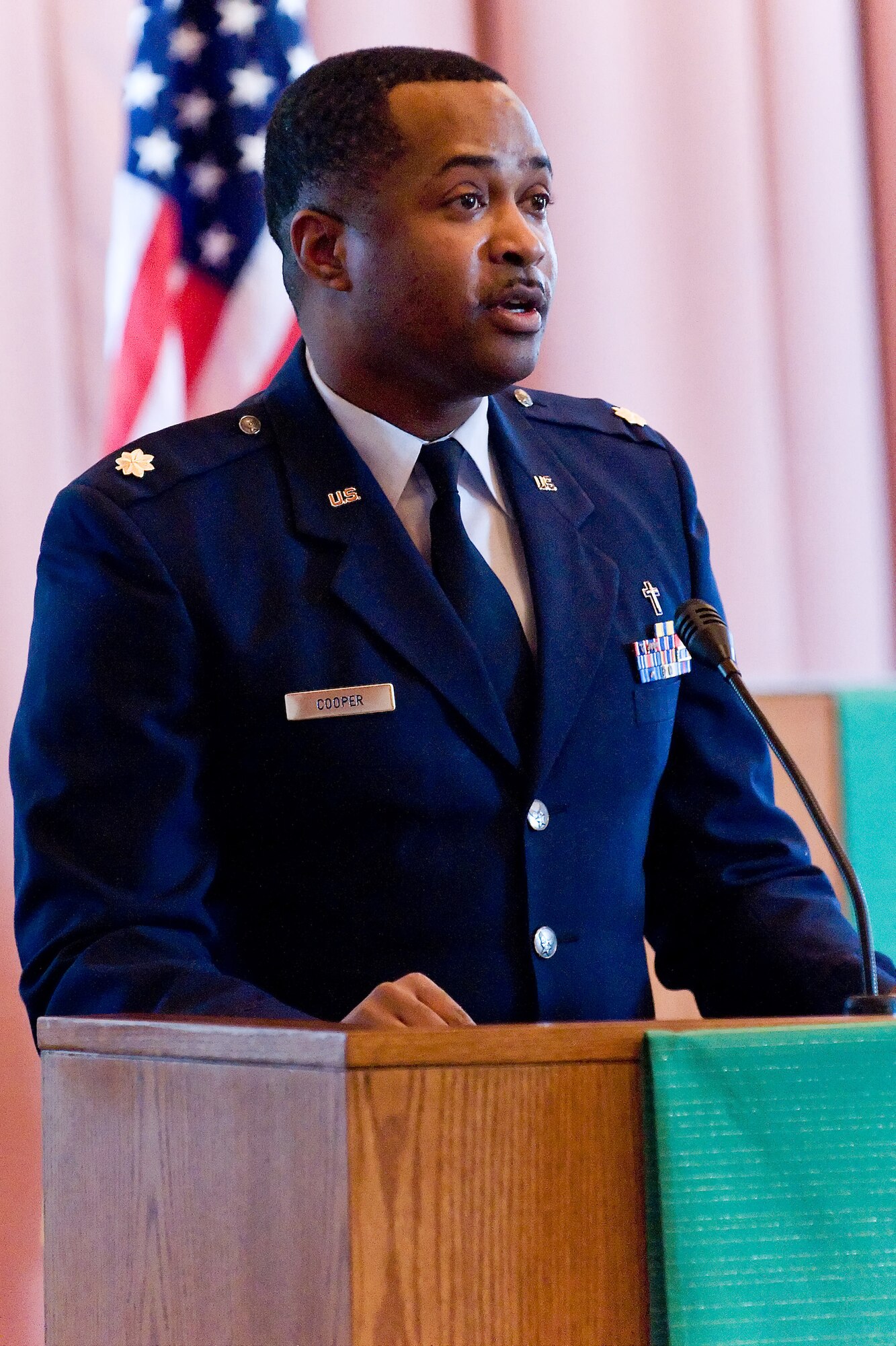 Maj. William Cooper, 512th Airlift Wing chaplain, delivers a speech Jan. 13 during a commemorative service honoring Martin Luther King Jr. at the base chapel. The speech focused on King?s ?Drum Major instinct? speech, and how it spoke of his leadership and the qualities of a good leader. (U.S. Air Force photo/Roland Balik)