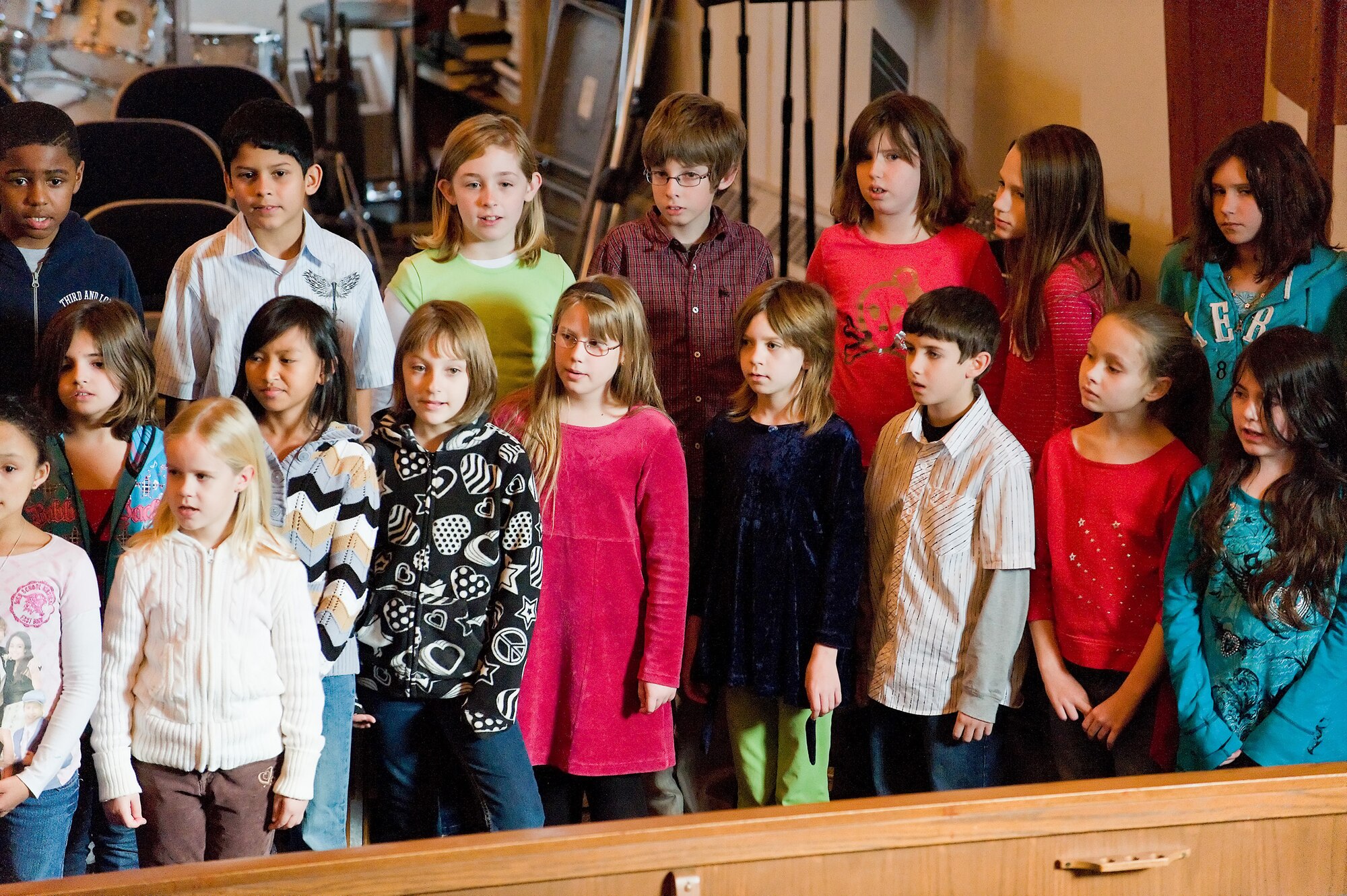 The Welch Elementary School choir sings a musical number to honor Martin Luther King Jr. during a commemorative service Jan. 13 at the base chapel. The service, which was themed, ?A Day on not a Day off! Passing on the dream to the next generation? commemorated the life and work of Doctor Martin Luther King Jr. (U.S. Air Force photo/Roland Balik)
