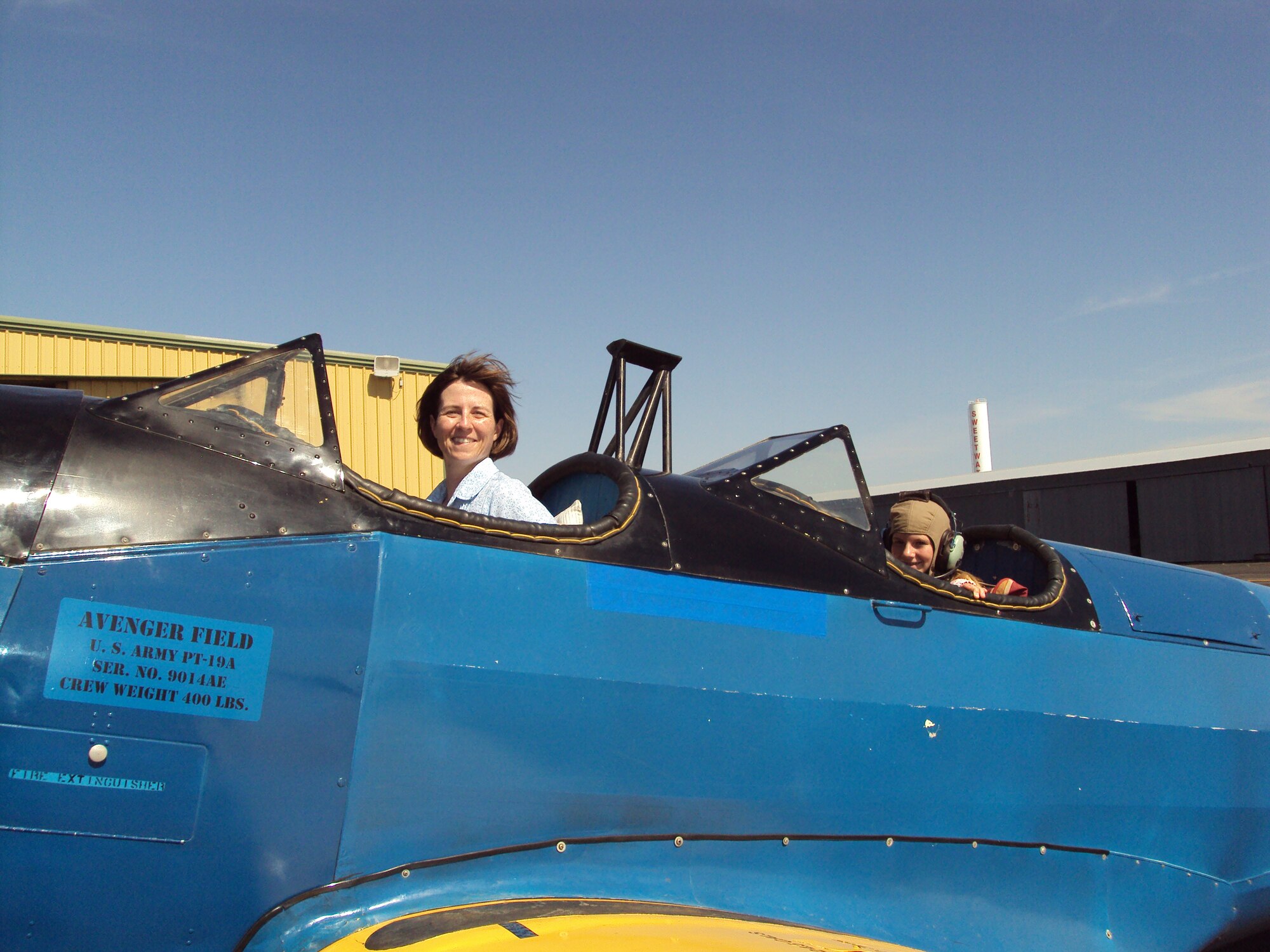 Maj. Bridget McNamara, a member of the board of directors for the National WASP World War II Museum in Sweetwater, Texas, took 12-year-old Shannon Grayup for her first open cockpit flight at Avenger Field near the museum in July 2009.(Courtesy Photo by Bill Johnson)