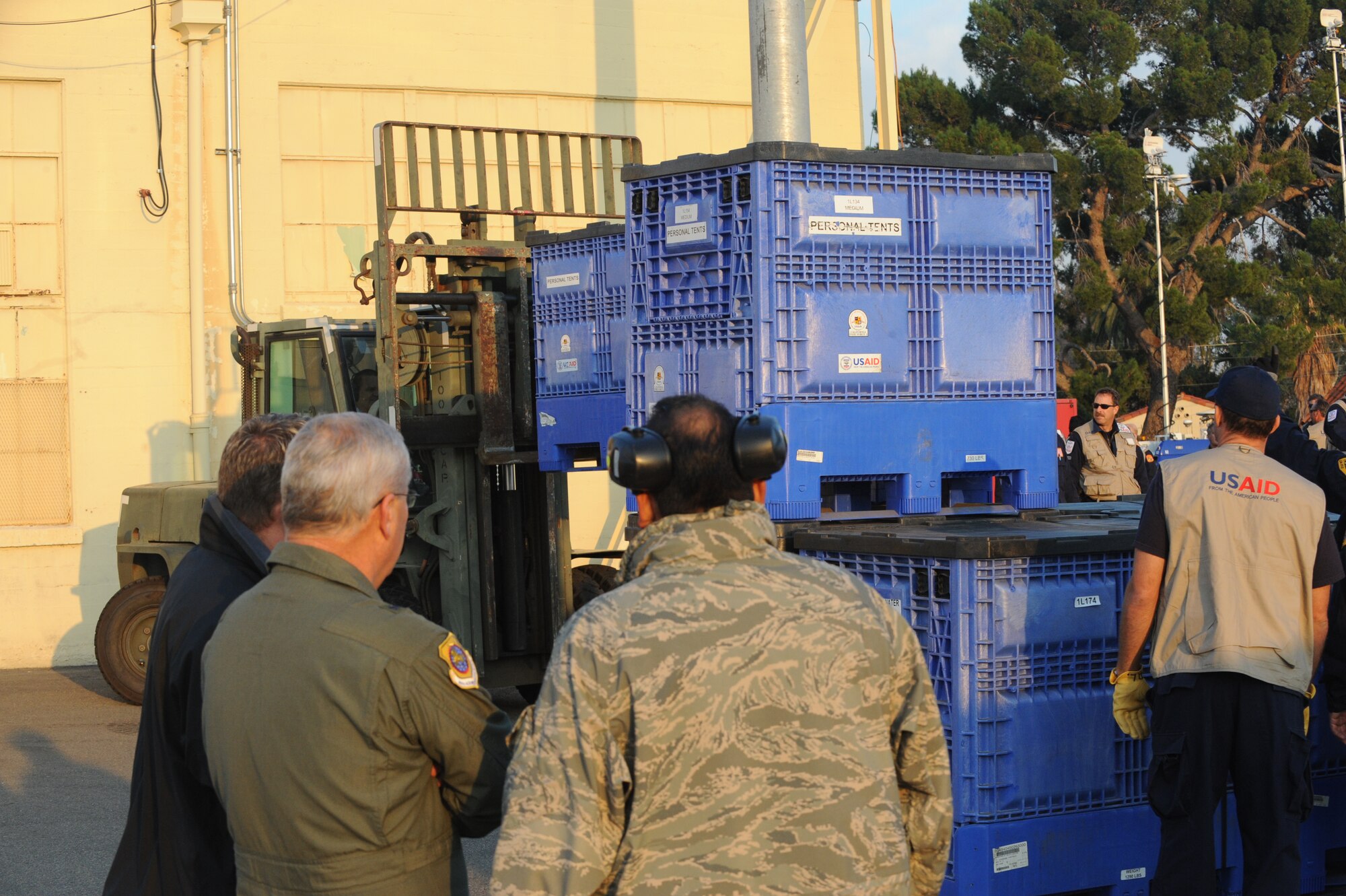 Brig. Gen. James Melin observes members of the USAID urban search and rescue team from the Los Angeles County Fire Department arrange their rescue equipment at March Air Reserve Base, Calif., in preparation for their Jan. 13 flight to Port-Au-Prince, Haiti, to assist with the earthquake relief effort.  The C-17 Globemaster III that transported the 72-person team and their equipment is from the 60th Air Wing, Travis Air Force Base, Calif.  The aircraft arrived in Haiti Jan. 14. (U.S. Air Force Photo/Master Sgt. Roy Santana)