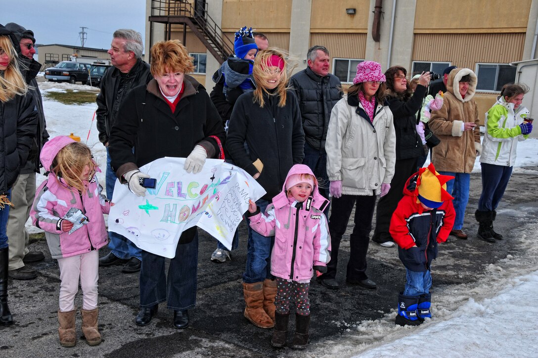 Deployed Air Force reserve members are welcomed home by friends and family, January 16, 2010, Niagara Falls Air Reserve Station, Niagara Falls, NY. Deployed Airmen are reunited with family and friends during a welcome home celebration at the Niagara Falls base. (U.S Air Force photo by Staff Sgt. Joseph McKee)