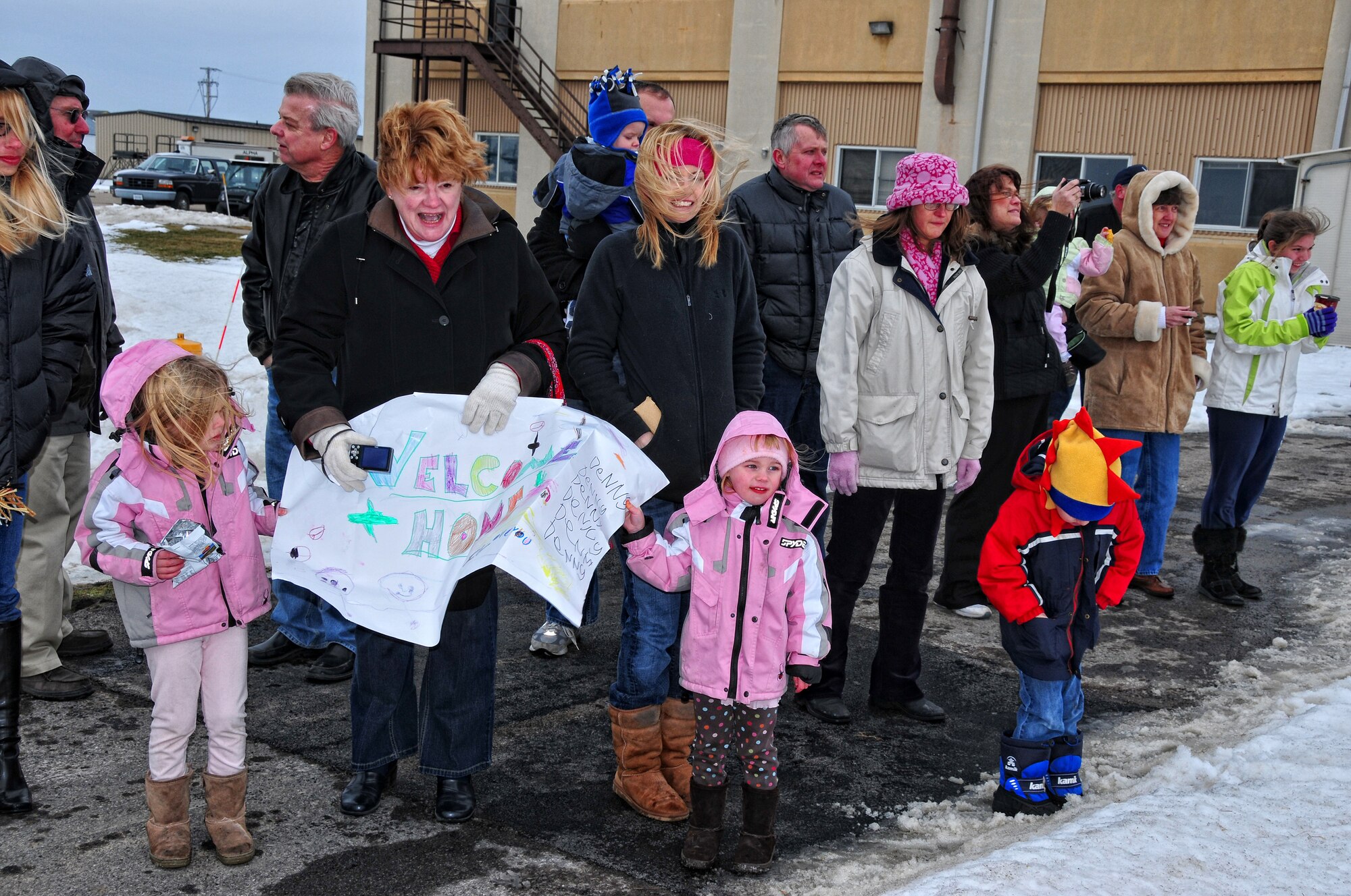 Deployed Air Force reserve members are welcomed home by friends and family, January 16, 2010, Niagara Falls Air Reserve Station, Niagara Falls, NY. Deployed Airmen are reunited with family and friends during a welcome home celebration at the Niagara Falls base. (U.S Air Force photo by Staff Sgt. Joseph McKee)