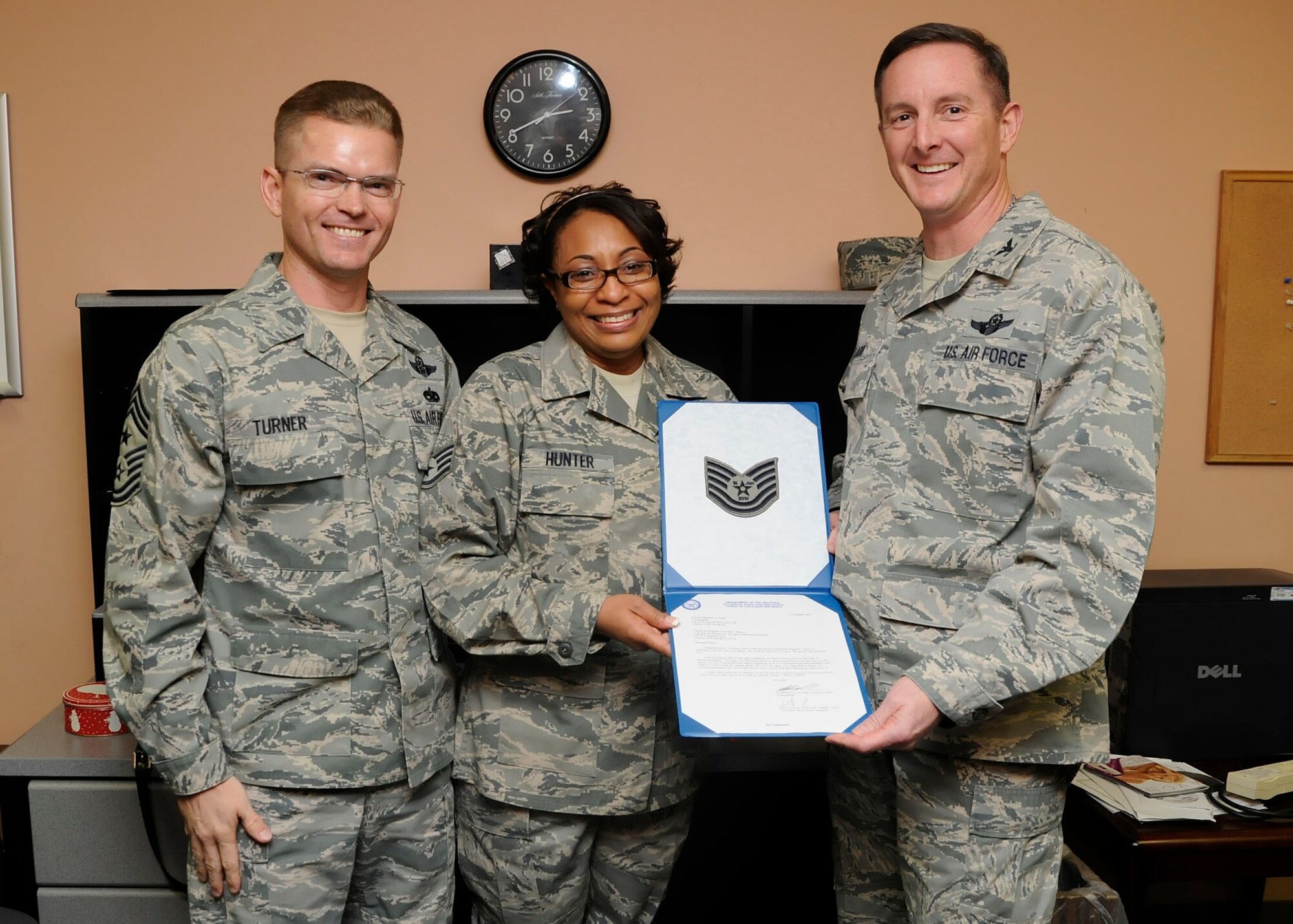 CANNON AIR FORCE BASE, N.M. -- Staff Sgt. Teronda Hunter, 27th Special Operations Aerospace Medicine Squadron, was promoted to technical sergeant under the Stripes for Exceptional Performer program by Command Chief Master Sgt. William Turner, 27th Special Operations Wing and Wing Commander Col. Stephen Clark, 27 SOW here 15 Jan. The STEP program releases a limited number of stripes each year to major commmands for Airman in the ranks of staff and technical sergeant. (U.S. Air Force photo/Senior Airman Erik Cardenas)