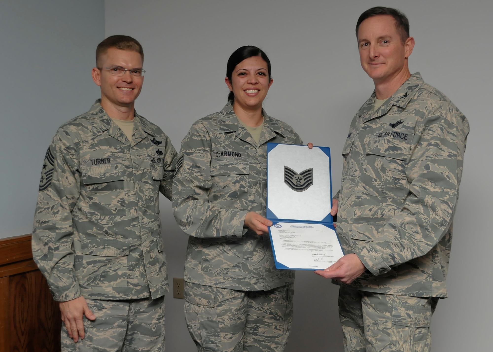 CANNON AIR FORCE BASE, N.M. -- Staff Sgt. Elizabeth DeArmond, 27th Special Operations Wing, was promoted to technical sergeant under the Stripes for Exceptional Performer program by Command Chief Master Sgt. William Turner, 27 SOW, and Wing Commander Col. Stephen Clark, here 15 Jan.The STEP program releases a limited number of stripes each year to major commmands for Airmen in the ranks of staff and technical sergeant. (U.S. Air Force photo/Senior Airman Erik Cardenas)