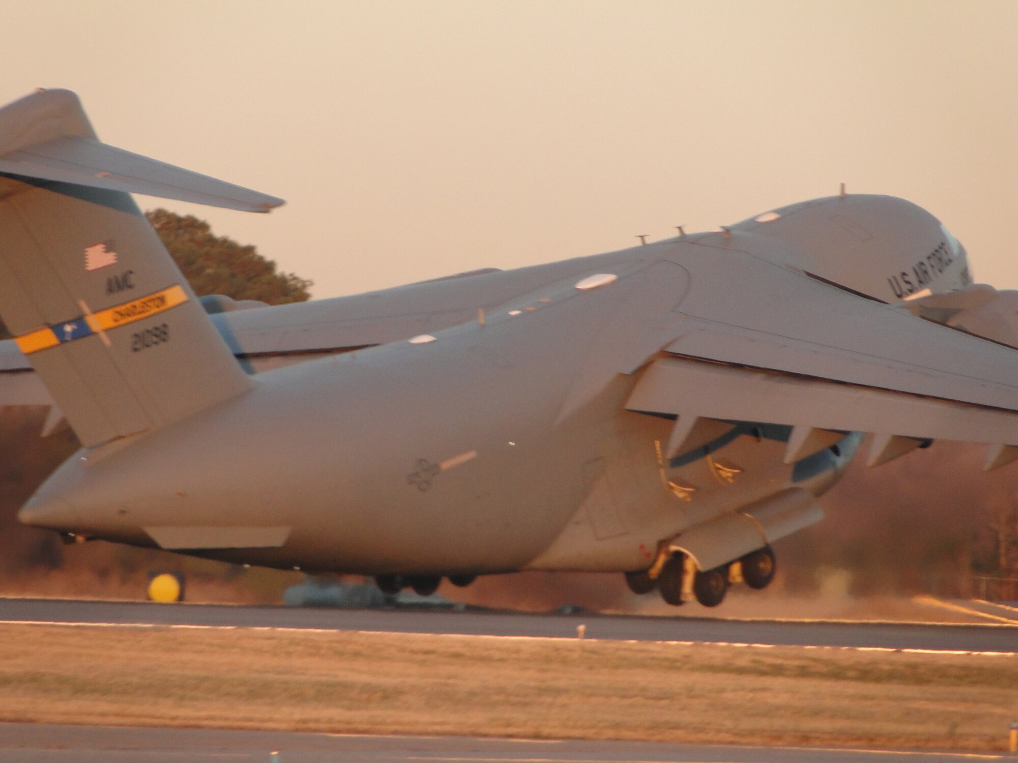 NORFOLK, Va. -- A 437th Airlift Wing C-17 Globemaster III from Charleston Air Force Base, S.C., takes off from Chambers Field, Naval Station Norfolk, Va., Jan. 15, 2010. The C-17 carried cargo and members of Virginia Task Force Two, a Federal Emergency Management Agency urban search and rescue team based in Virginia Beach, Va., to support ongoing relief operations in earthquake-stricken Haiti. (U.S. Air Force photo/Capt. Ed Ekpoudom)