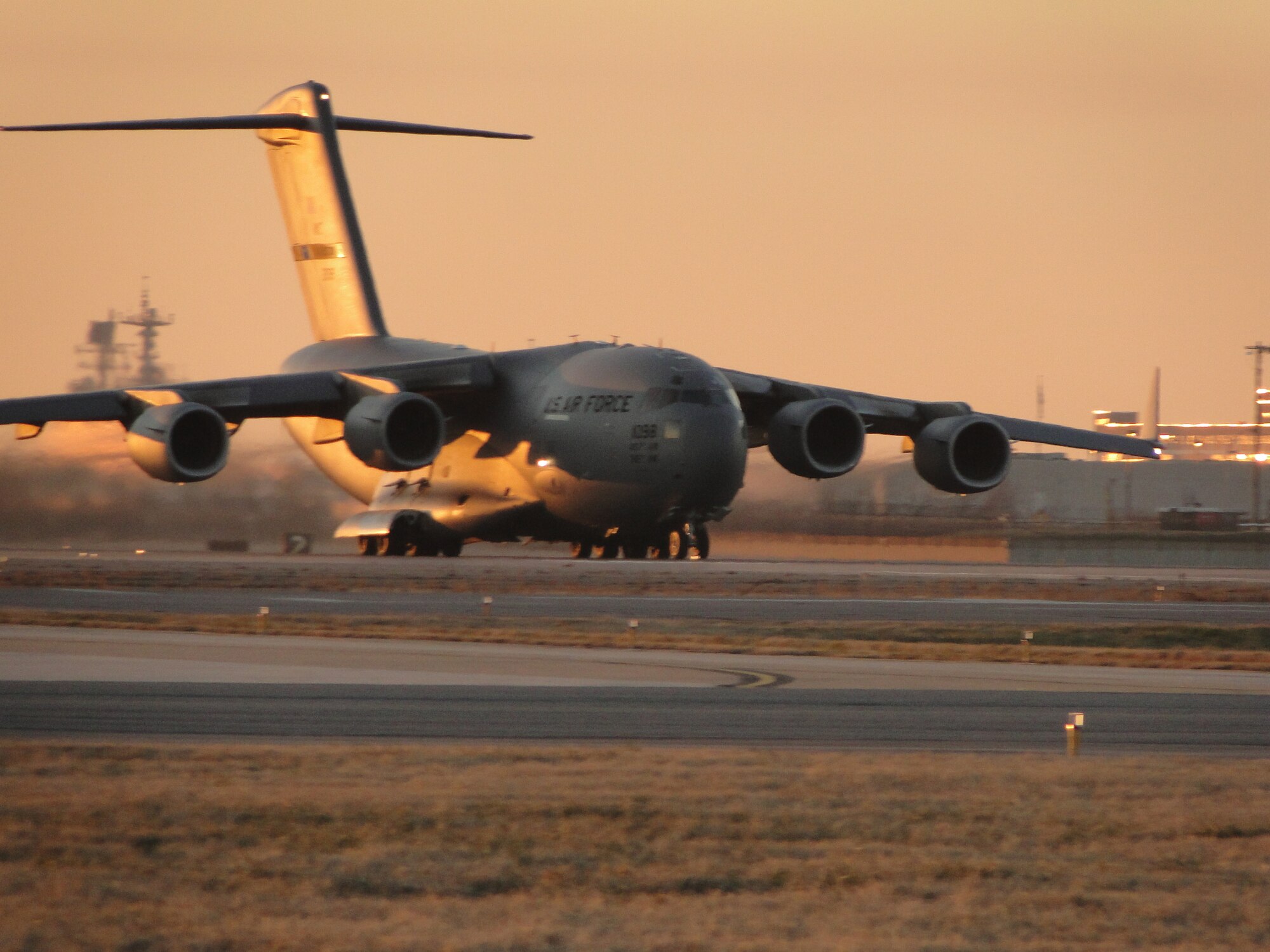 NORFOLK, Va. -- A 437th Airlift Wing C-17 Globemaster III from Charleston Air Force Base, S.C., departs for earthquake-stricken Haiti from Chambers Field, Naval Station Norfolk, Va., Jan. 15, 2010. The C-17 carried cargo and members of Virginia Task Force Two, a Federal Emergency Management Agency urban search and rescue team based in Virginia Beach, Va., to support ongoing relief operations. (U.S. Air Force photo/Capt. Ed Ekpoudom)
