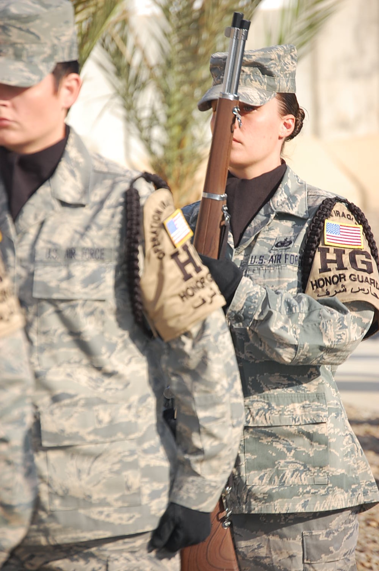 SOUTHWEST ASIA - Staff Sgt. Nichole Gladkowski, deployed from the 460th Security Forces Squadron at Buckley Air Force Base, Colo., carries a rifle as honor guard NCO in charge at her deployed location. Sergeant Gladkowski performs her honor guard details in addition to her primary duties as a security forces Defender. (U.S. Air Force photo)