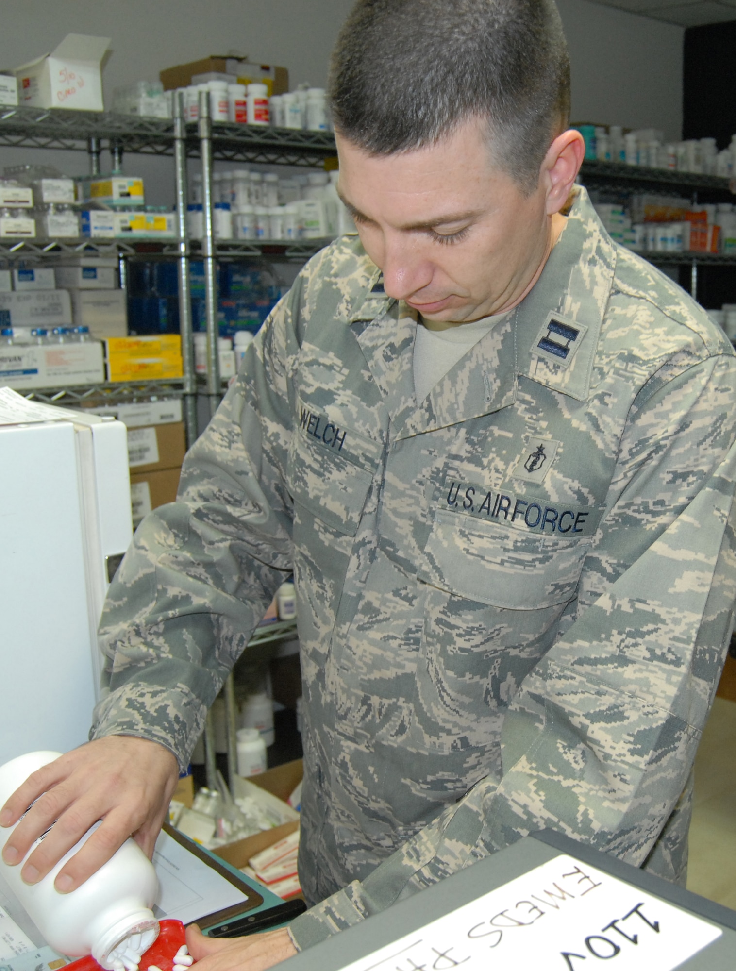 KIRKUK REGIONAL AIR BASE, Iraq - Capt. David Welch, a pharmacist with the 506th Expeditionary Medical Squadron and diagnostic and therapeutic flight commander, fills a prescription for a servicemember at his pharmacy shop Jan. 18, 2010. Captain Welch is deployed from the 96th Medical Support Squadron, Eglin AFB, Fla. 