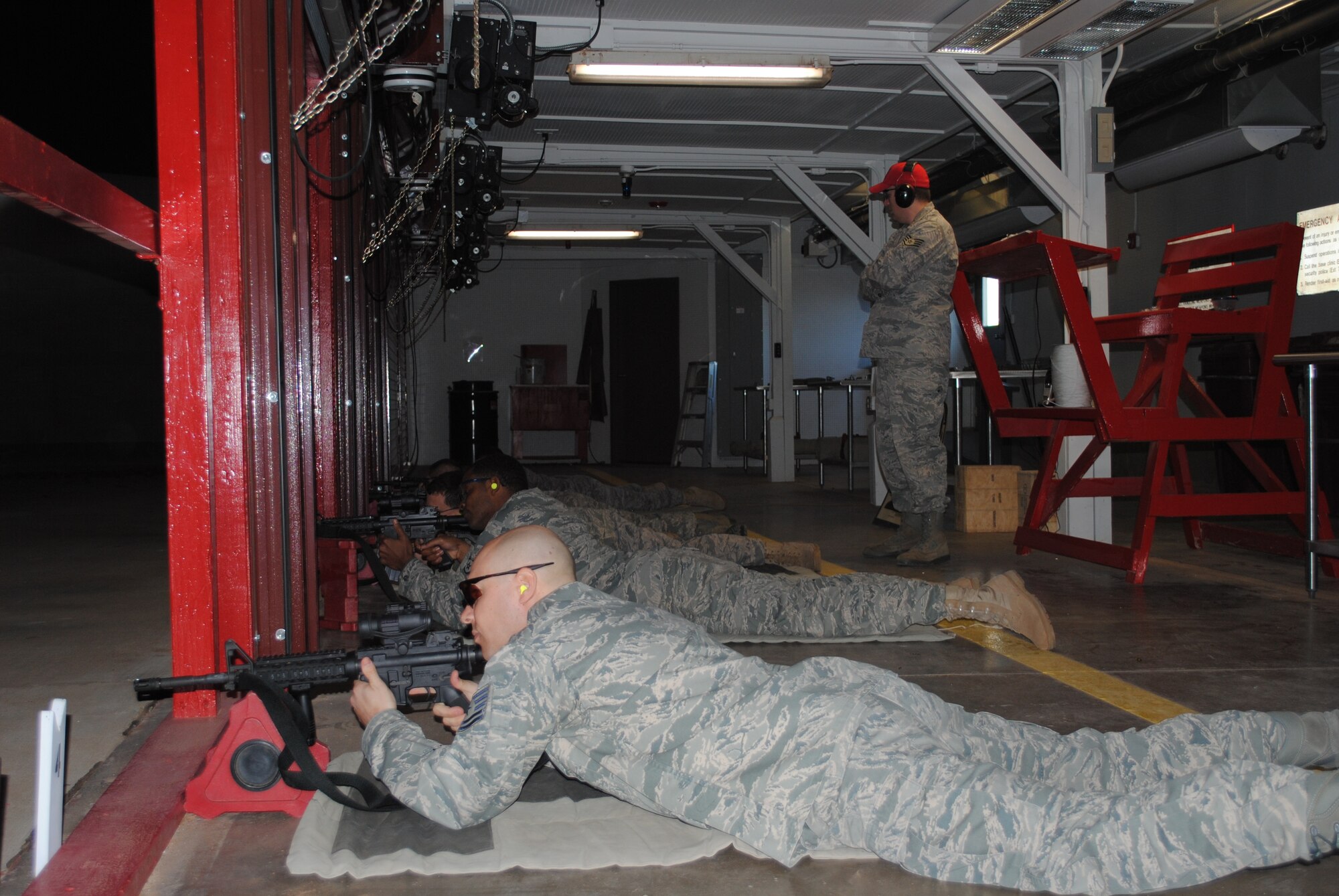 SSgt. Bradley Hancock, combat arms instructor, oversees four Airmen in Vance AFB's updated firing range (U.S. Air Force photo/2nd Lt. Christopher Carrillo).
