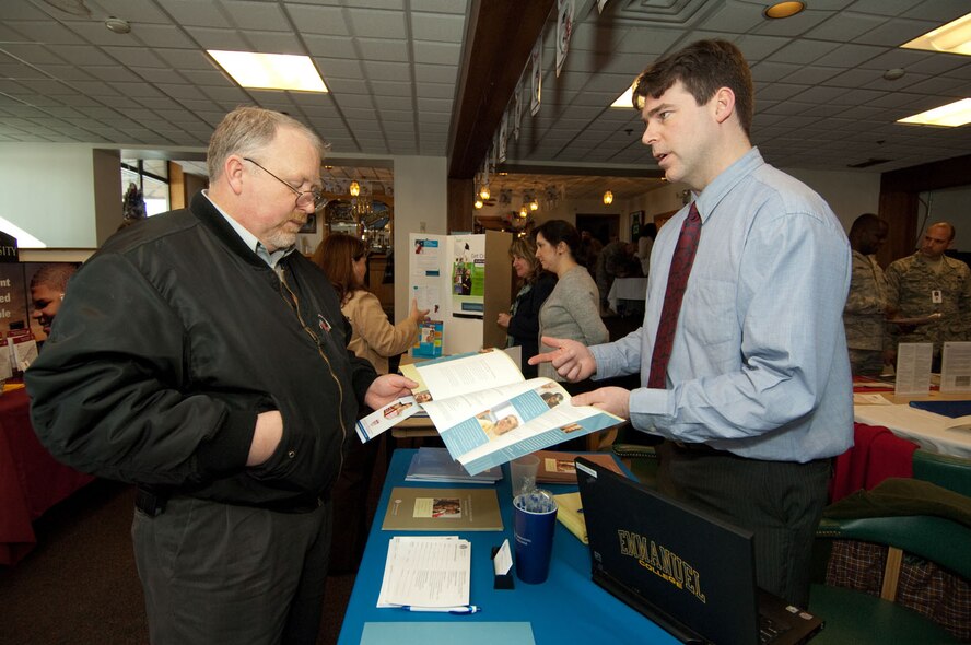 Rob O' Dwyer (right), from Emmanuel College, provides information about the college to Terry Goodwin, 631st Electronic Systems Squadron, at the Hanscom Education and Training Center's Education Fair, held Jan 14. The Education Fair offered members of the Hanscom community the opportunity to meet with representatives from schools in the New England area to discuss higher education goals and options.  (U.S. Air Force photo by Rick Berry)