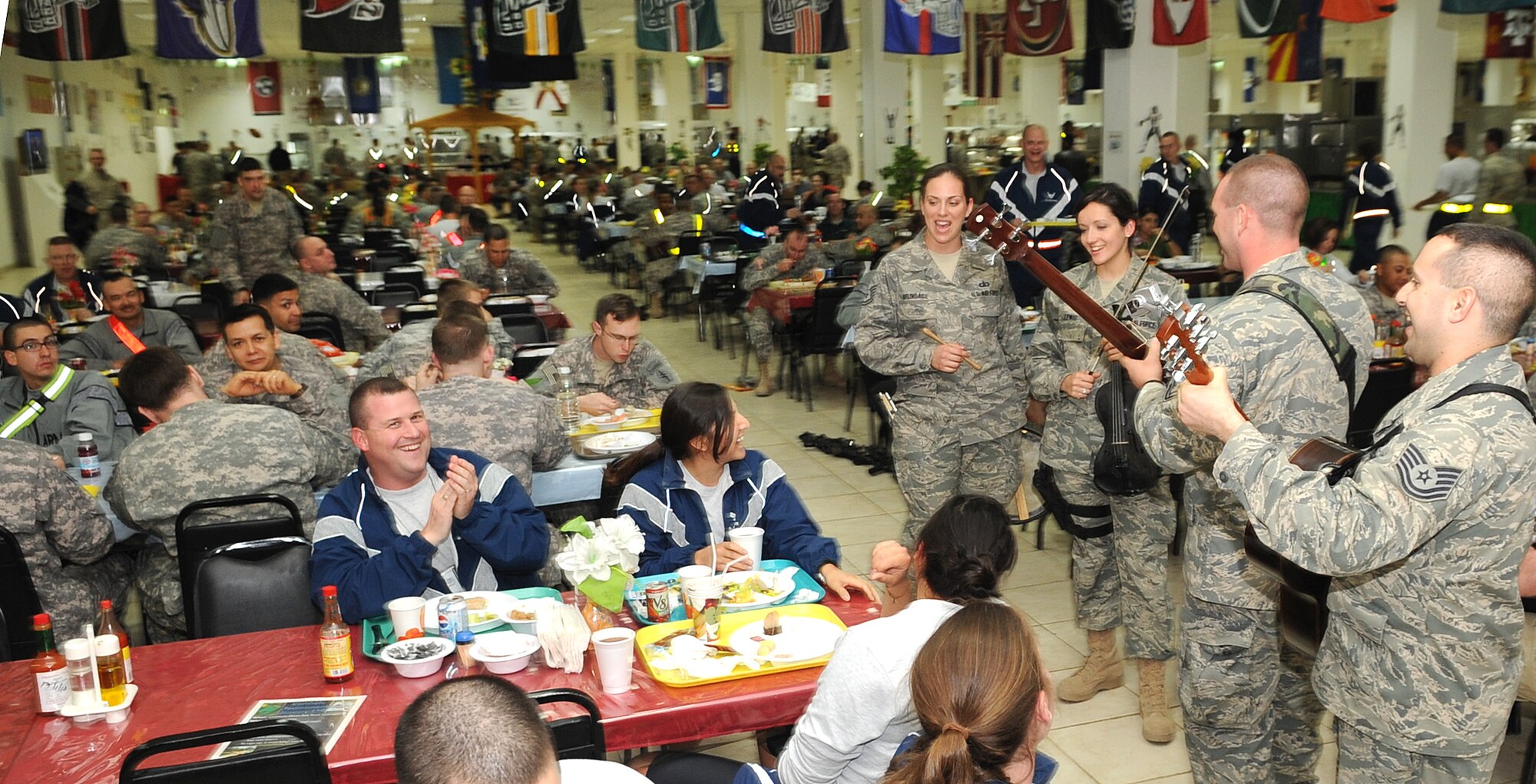 KIRKUK REGIONAL AIR BASE, Iraq – U.S. Air Forces Central Band Celtic Aire perform traditional Celtic tunes for Airmen and Soldiers at the dining facility Jan. 17, 2010.  The AFCENT band travels to many deployed locations to offer foot-stomping, energetic instrumentals as well as heart-warming ballads for U.S. forces around the world.  (U.S. Air Force photo/Staff Sgt. Tabitha Kuykendall)	