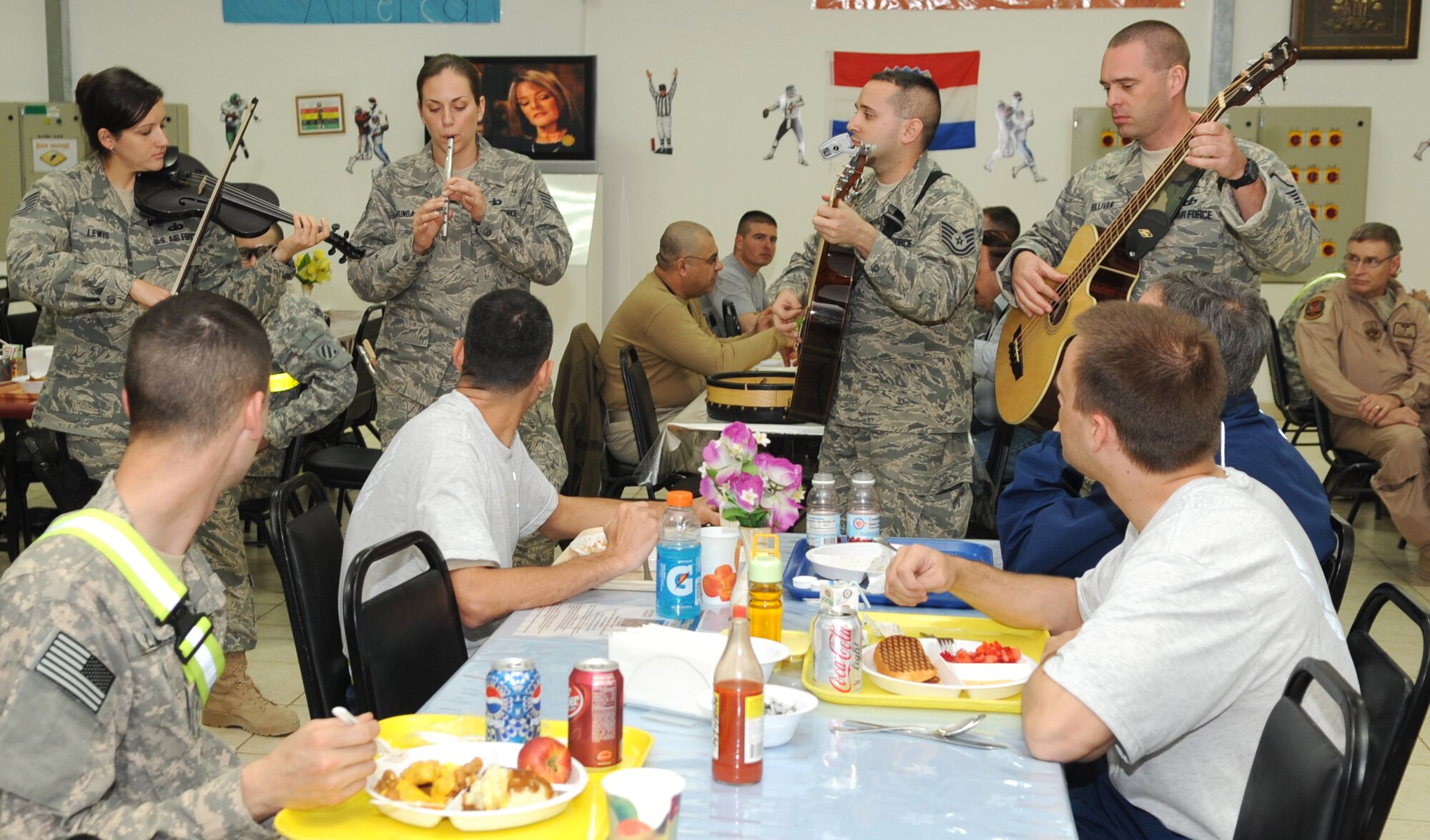 KIRKUK REGIONAL AIR BASE, Iraq – U.S. Air Forces Central Band Celtic Aire perform traditional Celtic tunes for Airmen and Soldiers at the dining facility Jan. 17, 2010.  The AFCENT band travels to many deployed locations to offer foot-stomping, energetic instrumentals as well as heart-warming ballads for U.S. forces around the world.  (U.S. Air Force photo/Staff Sgt. Tabitha Kuykendall)	